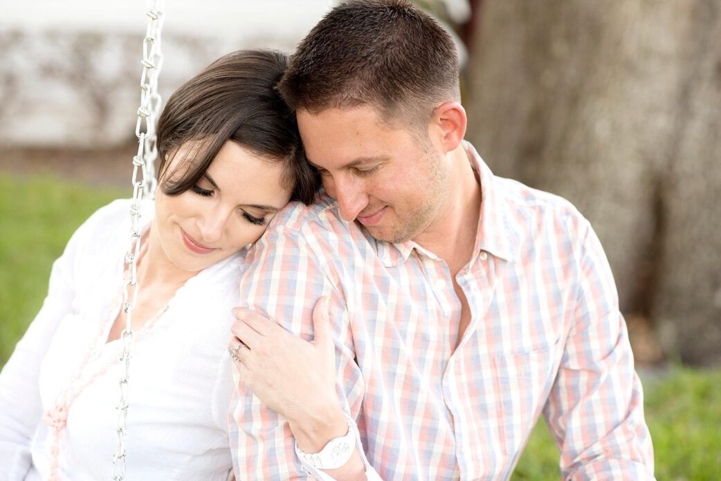 Mikkel Paige Photography in downtown Orlando, Florida engagement shoot. Tire swing and couple hugging.