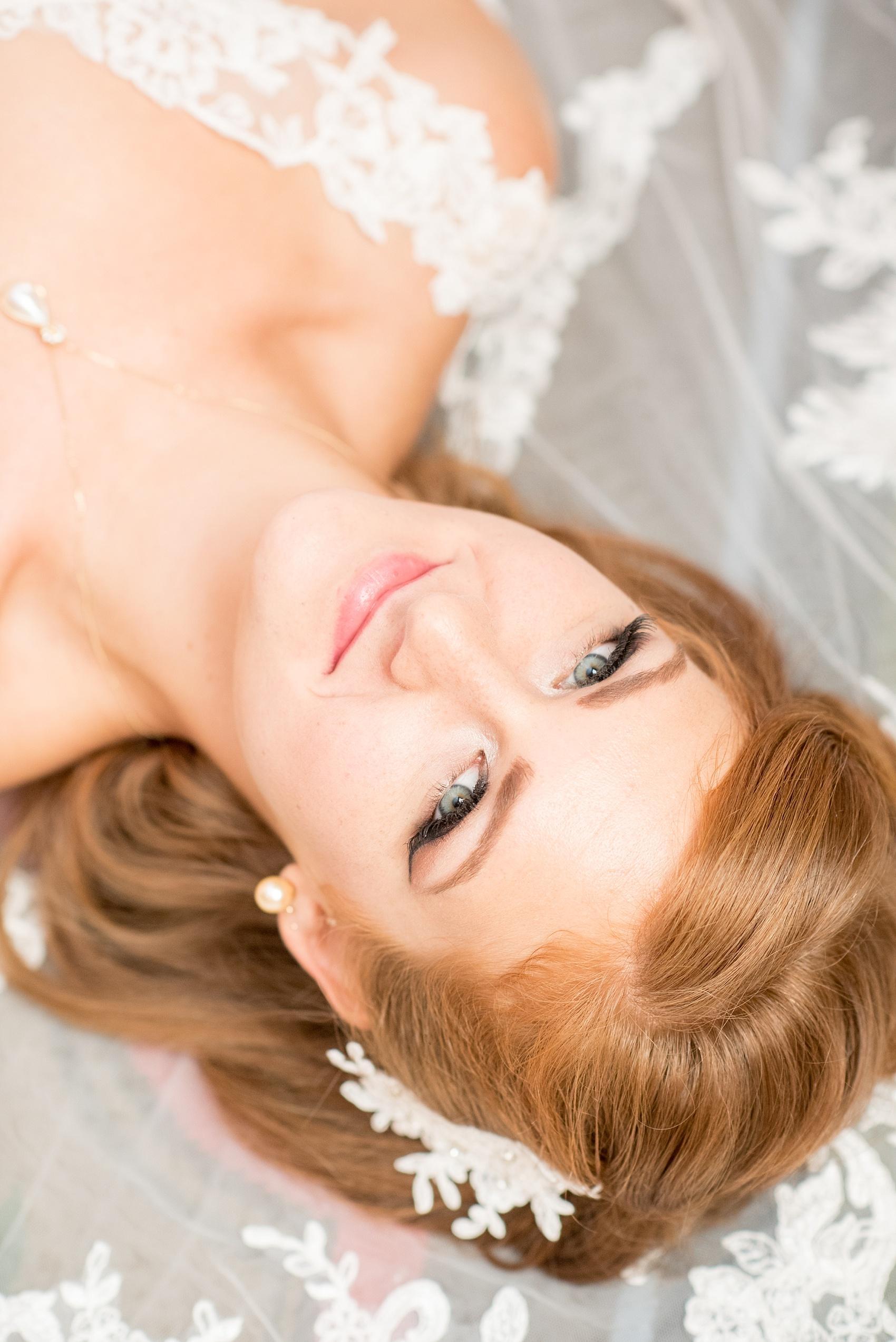 The Carolina Inn bridal portraits by Raleigh wedding photographer Mikkel Paige Photography. Vintage cat-eye look for the bride in white lace with red hair.