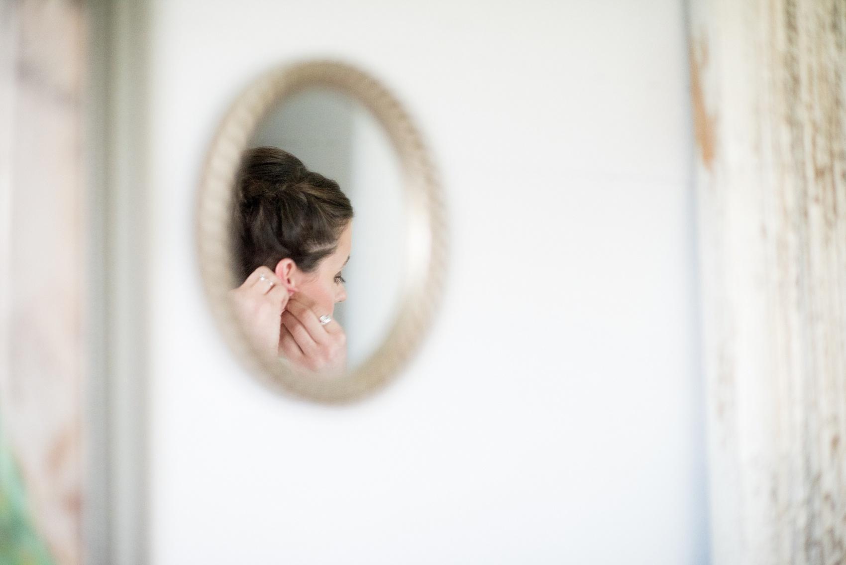 A unique photos as the bride prepares for her wedding day at Four Oaks Manor in Atlanta. Images by Mikkel Paige Photography.