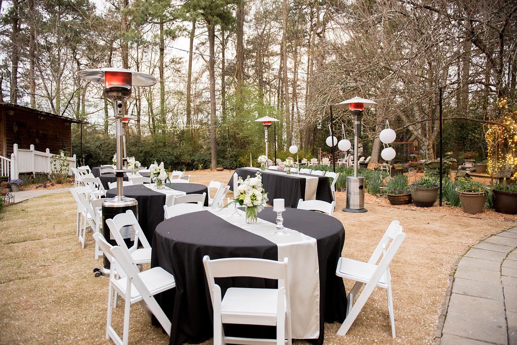 Four Oaks Manor wedding in Atlanta with black linens, paper lanterns, and white flowers. Photos by Mikkel Paige Photography.