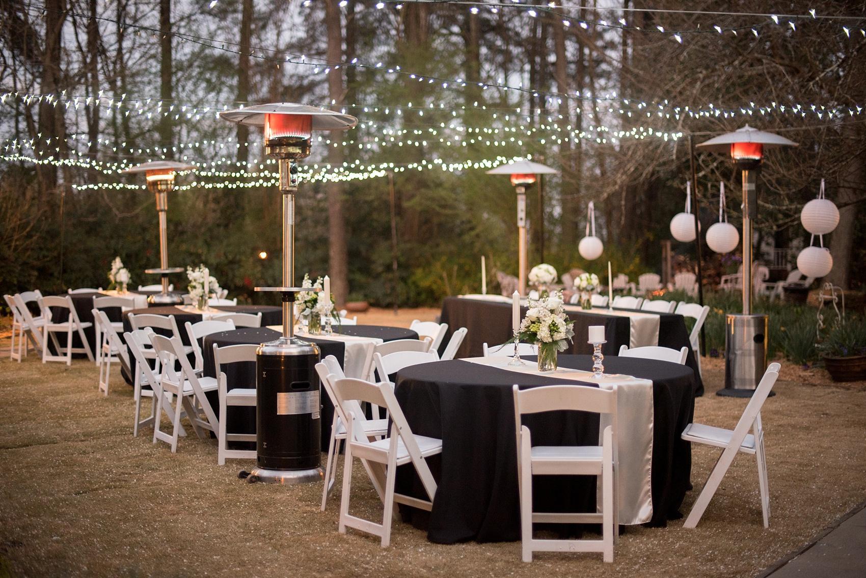 Four Oaks Manor wedding in Atlanta with black linens, paper lanterns, and white flowers in mason jars. Photos by Mikkel Paige Photography.