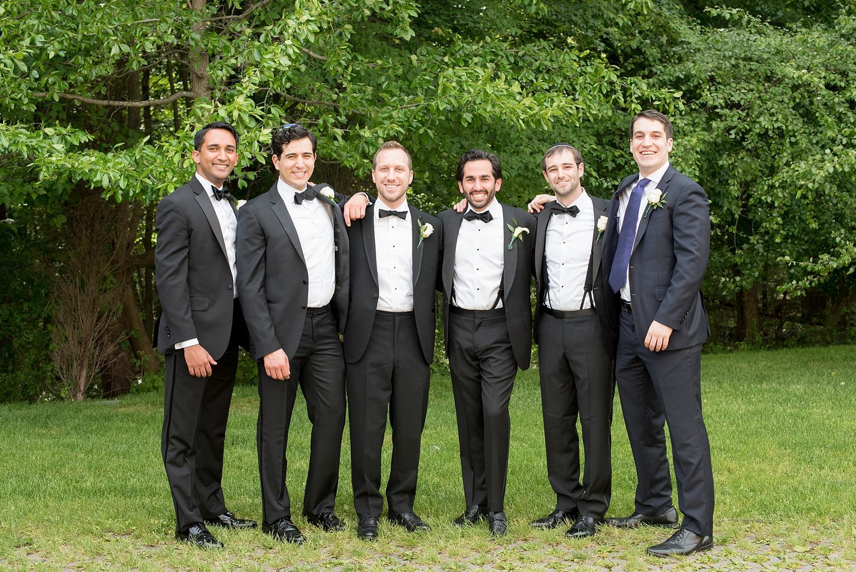 New Jersey wedding photos by Mikkel Paige Photography in Closter, NJ at Temple Emanu-el. Groom with his best guy friends.