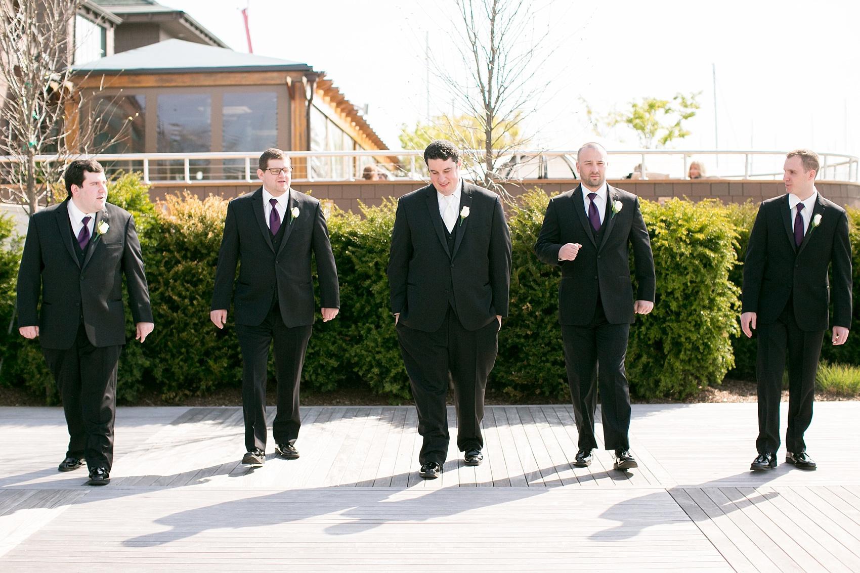 Photos by Mikkel Paige Photography for a wedding at Harbor Club on Long Island. Groomsmen in classic black for waterfront nuptials.