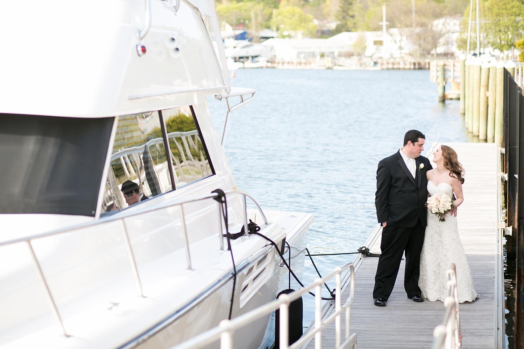 Photos by Mikkel Paige Photography for a wedding at Harbor Club on Long Island. Waterfront bride and groom yacht portraits.