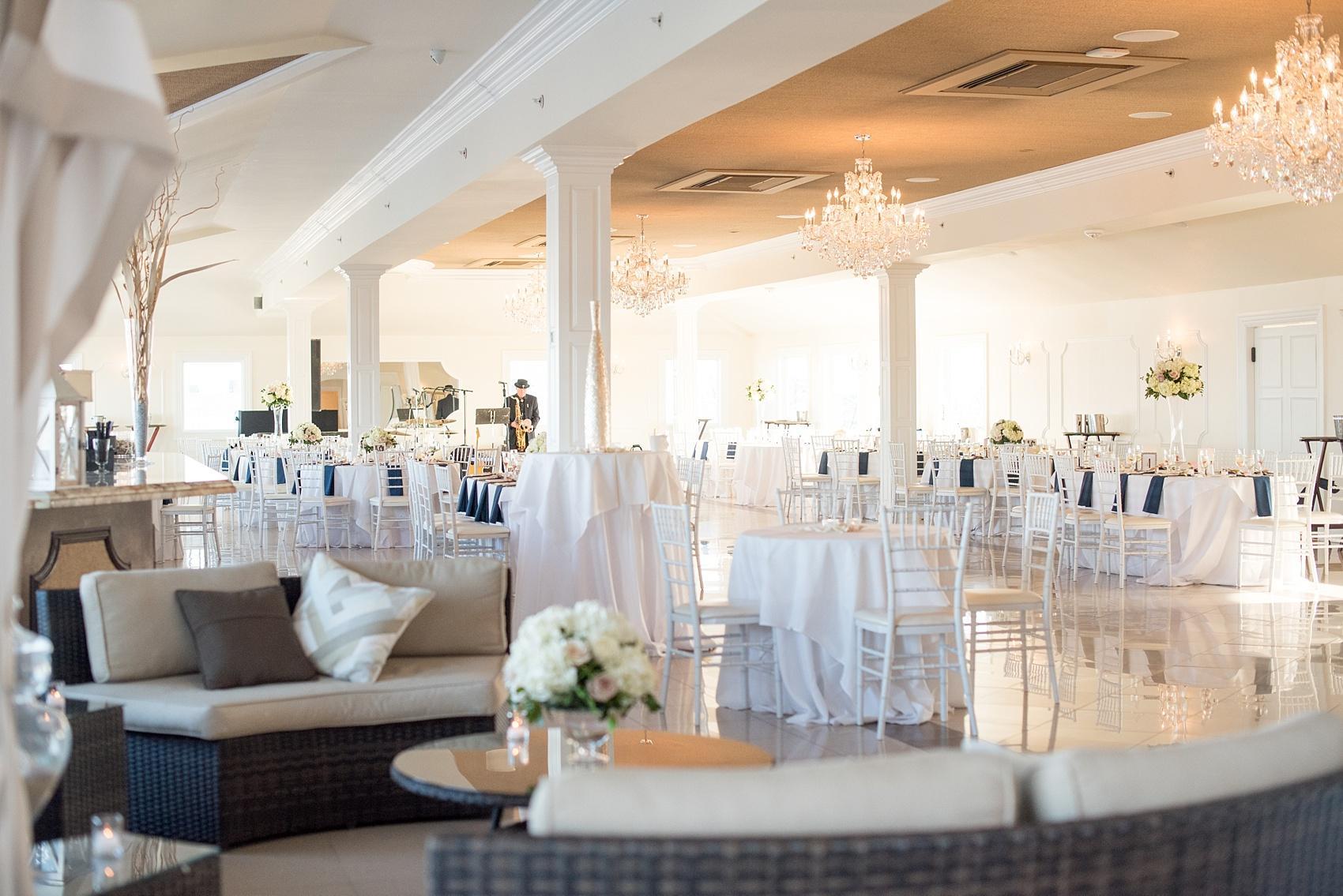 Photo by Mikkel Paige photography. Windows on the Water beach wedding with white flowers and navy blue accents.