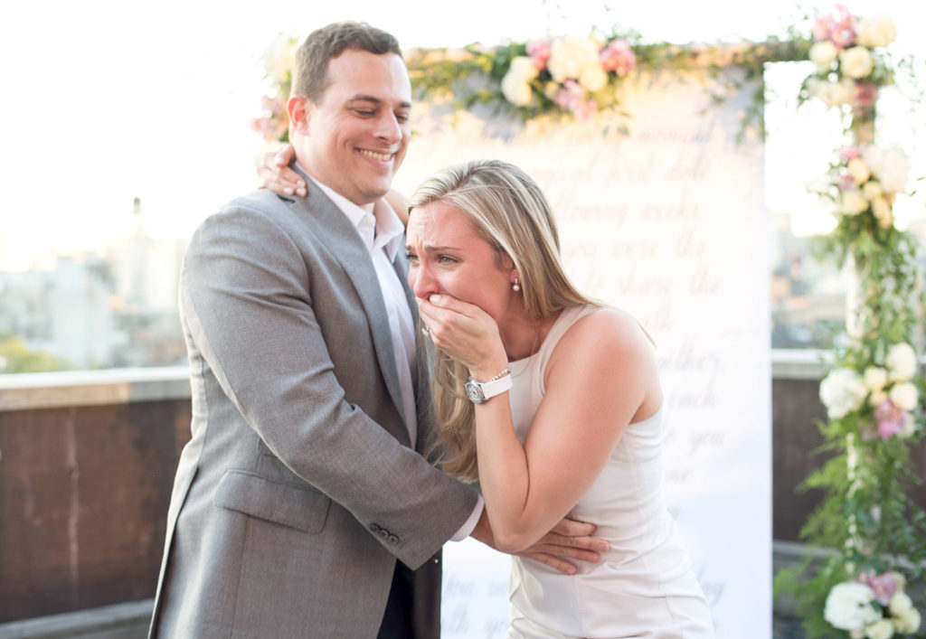 NYC rooftop proposal photos by Mikkel Paige Photography, New York wedding photographer. The bride's family surprises her!