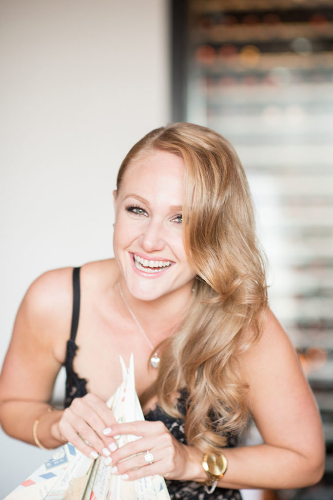 NYC Proposal Photographer Mikkel Paige Photography captures a travel themed marriage proposal in Columbus Circle with a rectangle diamond engagement ring and paper airplanes.