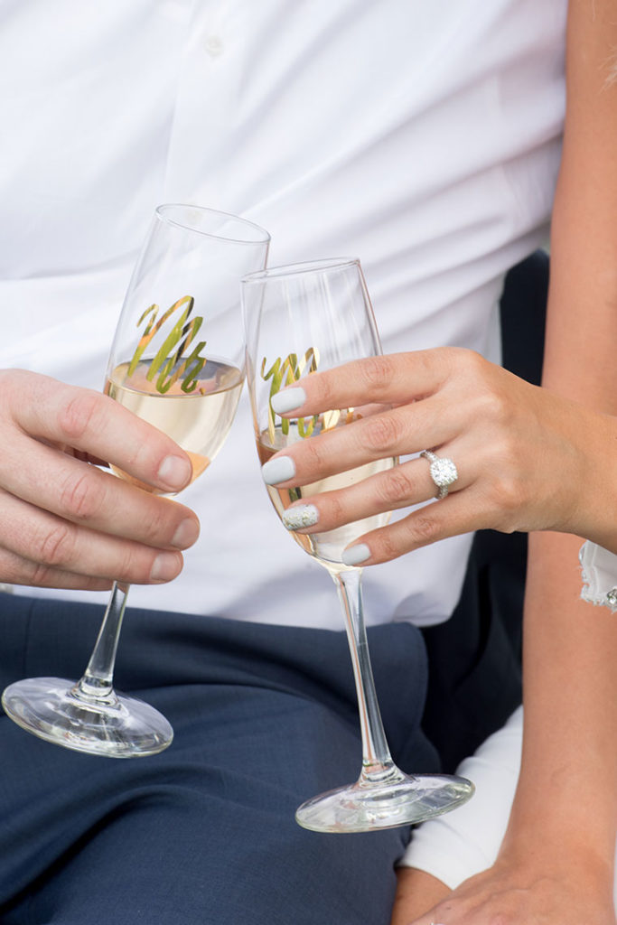 Mikkel Paige Photography, NYC wedding photographer, captures a marriage proposal at Glenmere Mansion in the lower Hudson Valley region. Mr. and Mrs. champagne flute cheers!