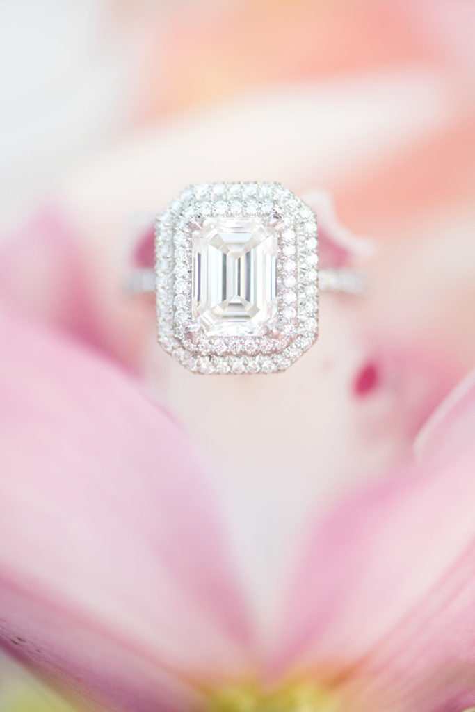 NYC rooftop proposal photos by Mikkel Paige Photography, New York wedding photographer. Emerald cut, halo diamond engagement ring.