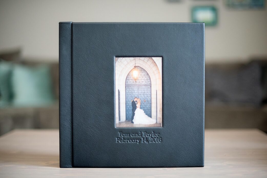 Mikkel Paige Photography photos of a black fine art leather wedding album with subtle Disney "Happily Ever After" theme.