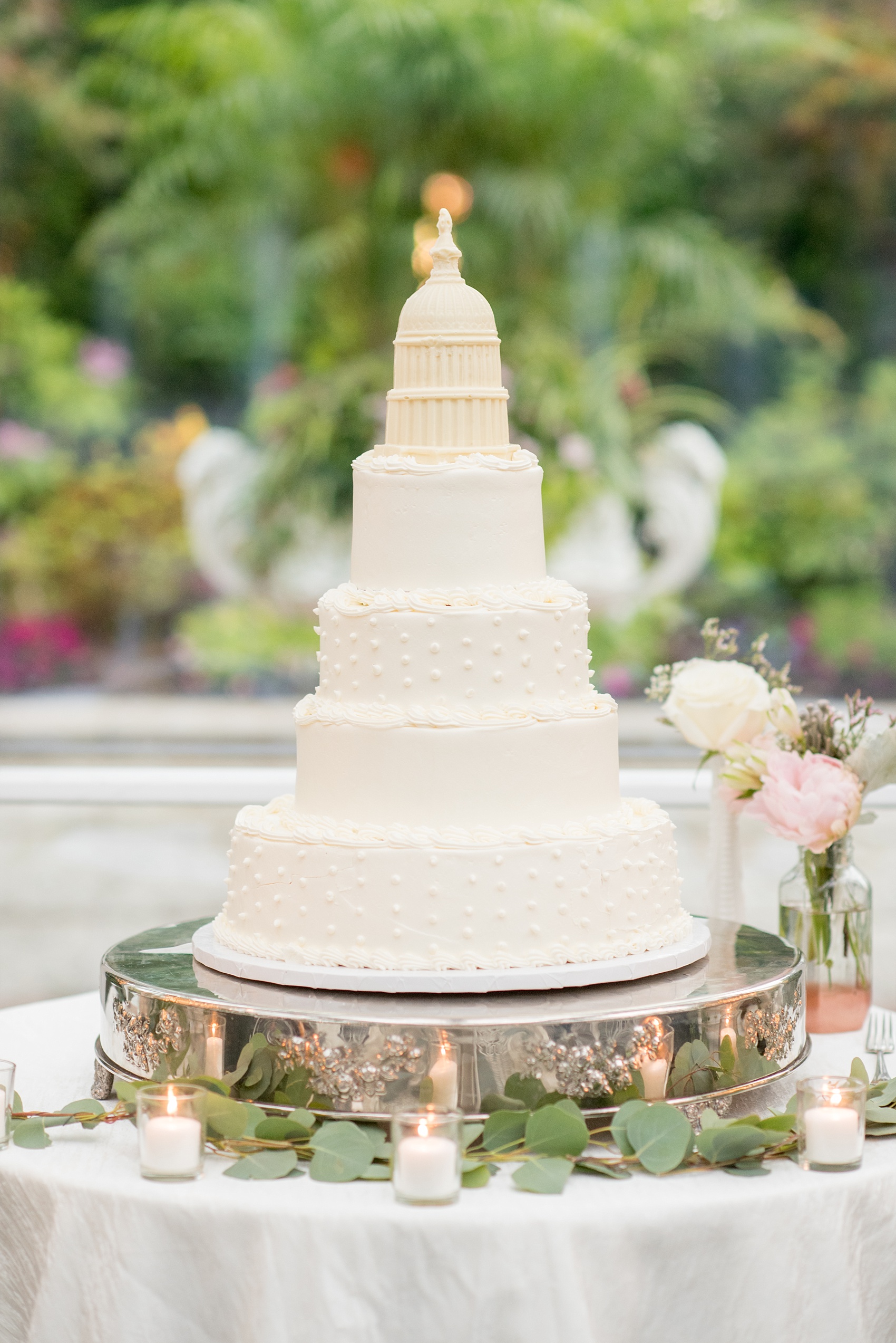 Mikkel Paige Photography photo of a wedding at Madison Hotel in NJ. Photo of the Congress Capital Dome wedding cake in The Conservatory.