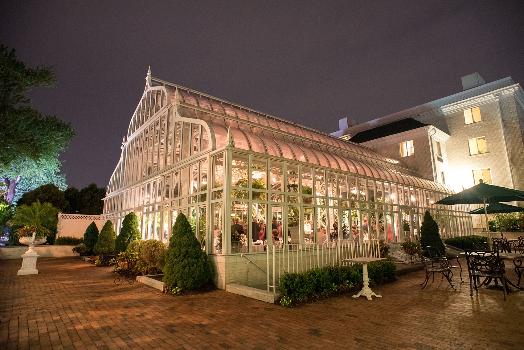 Mikkel Paige Photography photo of a wedding at Madison Hotel in NJ with a night image of The Conservatory.