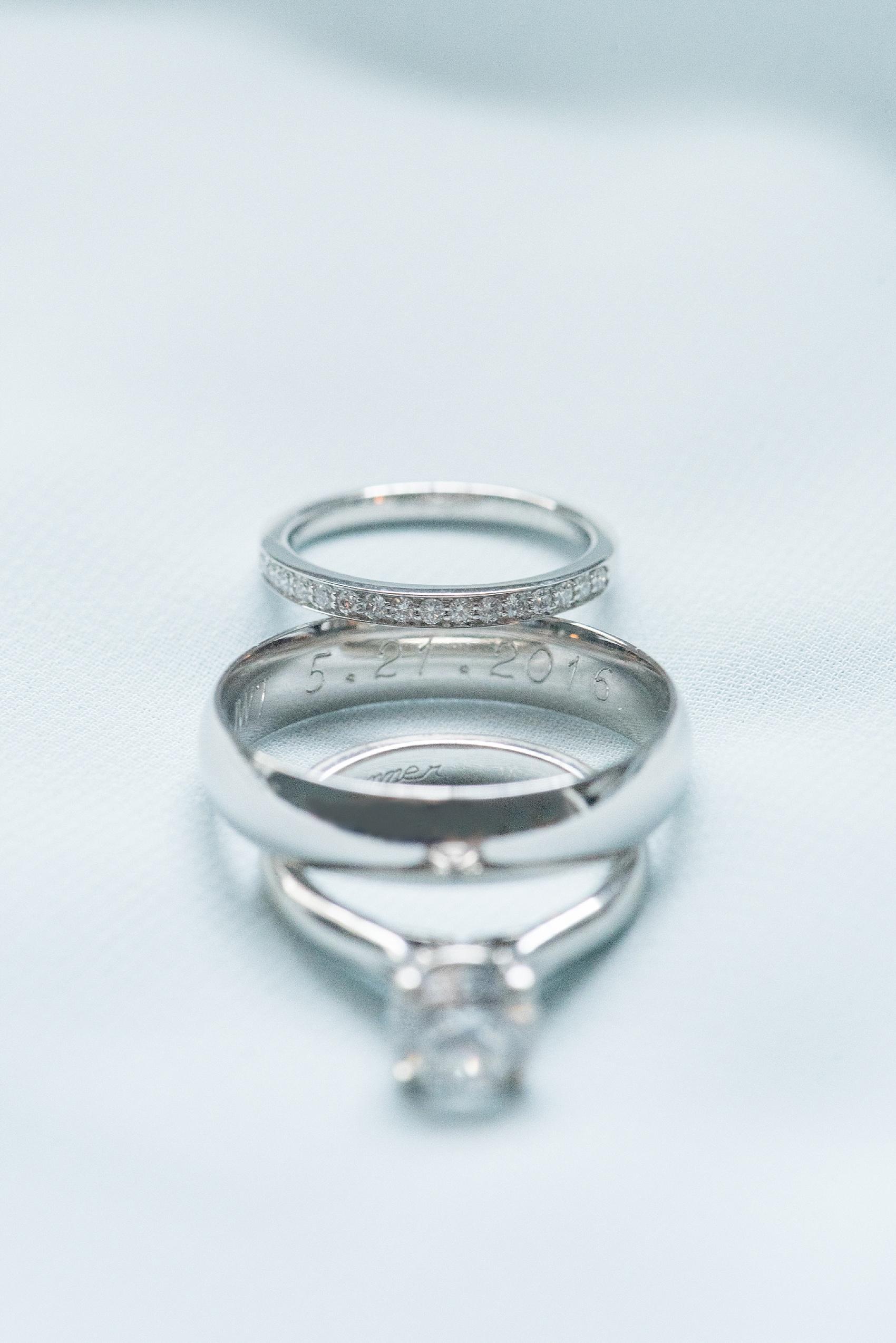 Mikkel Paige Photography pictures of a wedding in downtown Raleigh. Detail photos of a white gold set of rings. 