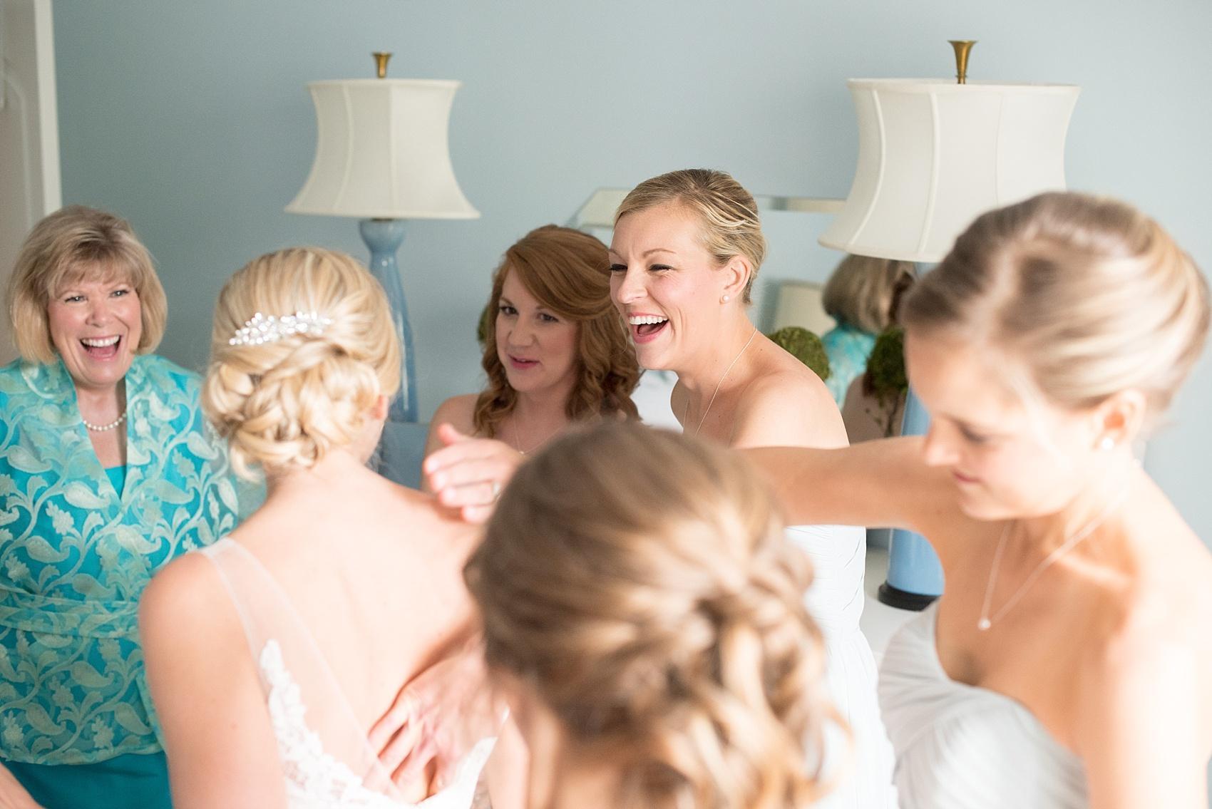 Mikkel Paige Photography pictures of a wedding in downtown Raleigh. Photo of the bride getting ready at her parents home with her bridesmaids.