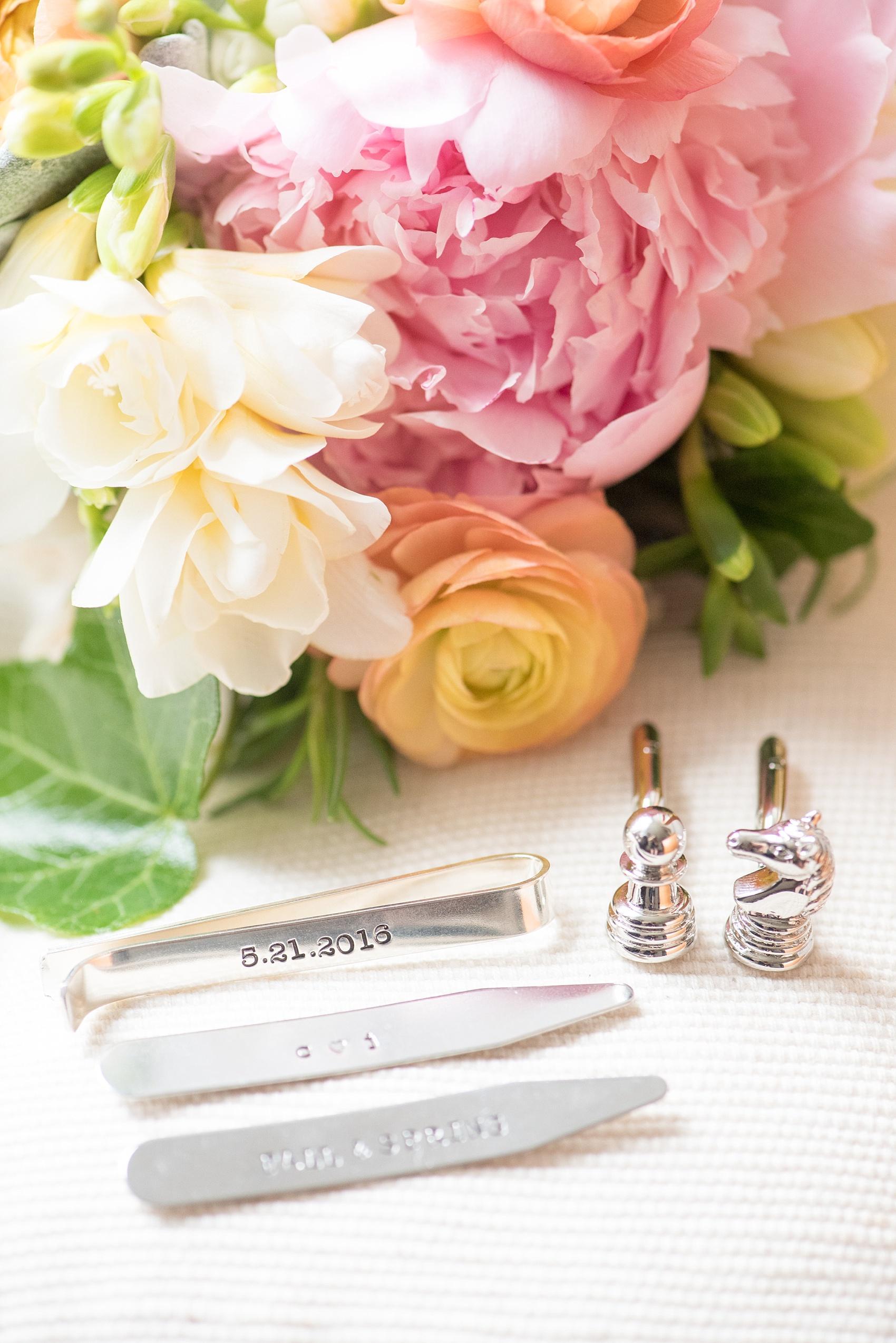 Mikkel Paige Photography for a Market Hall wedding in downtown Raleigh. Groom detail image of his custom chess cufflinks and collar stays and tie clip.