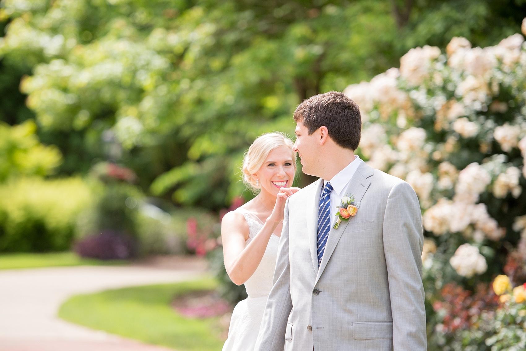 Mikkel Paige Photography pictures of a wedding in downtown Raleigh. Photo of the bride and groom's first look in her family's garden.