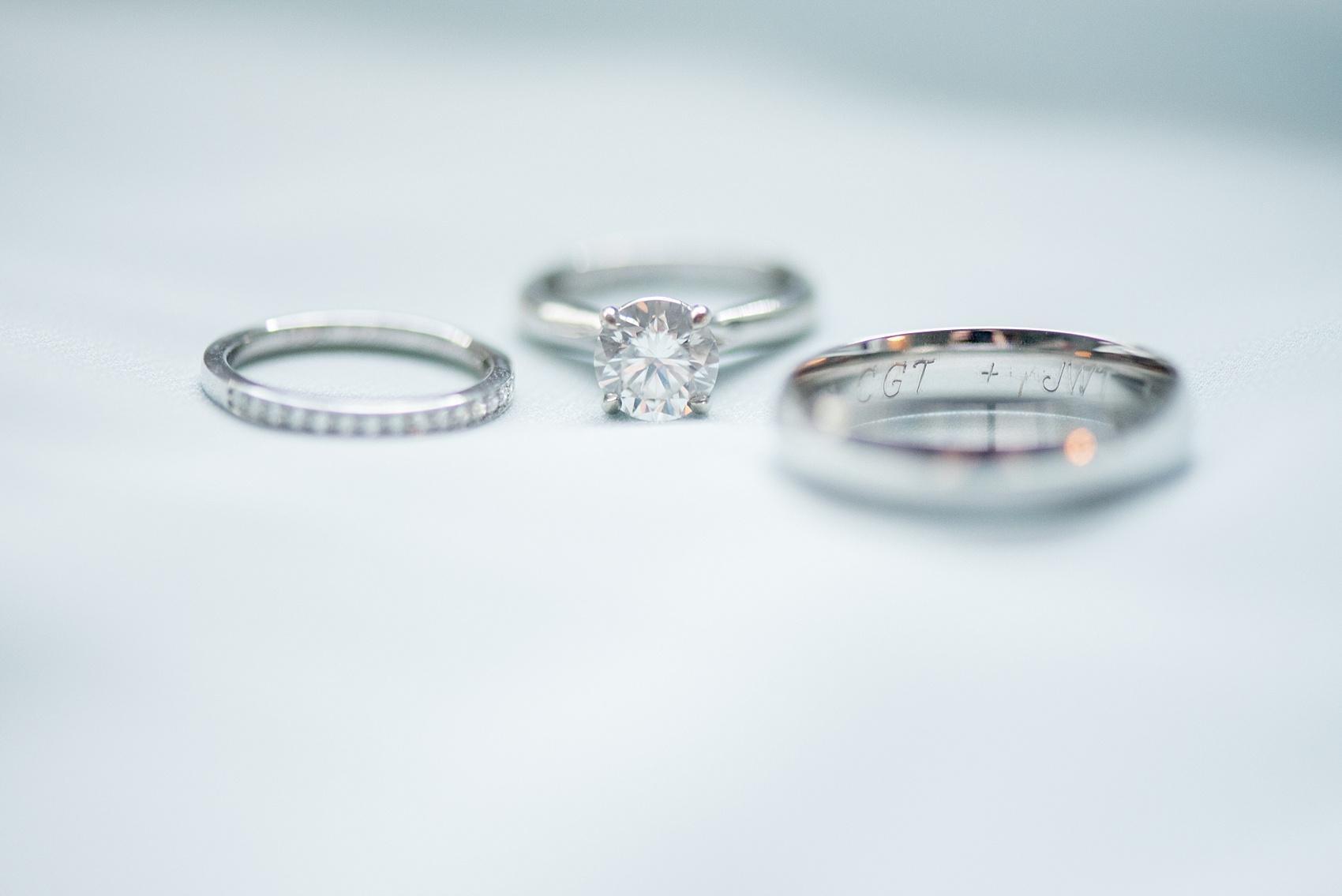 Mikkel Paige Photography pictures of a wedding in downtown Raleigh. Detail photos of a white gold set of rings. 
