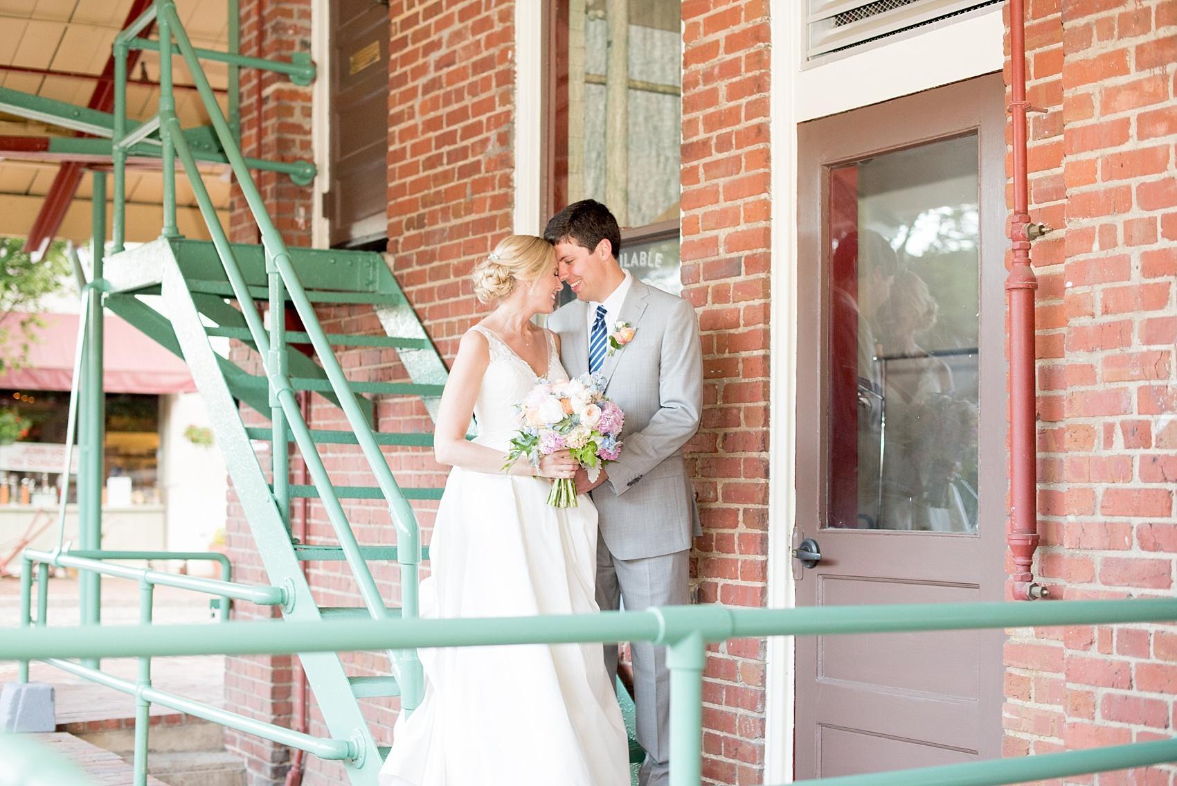 Mikkel Paige Photography pictures of a wedding in Raleigh. Photo of the bride and groom near Market Hall at City Market downtown.