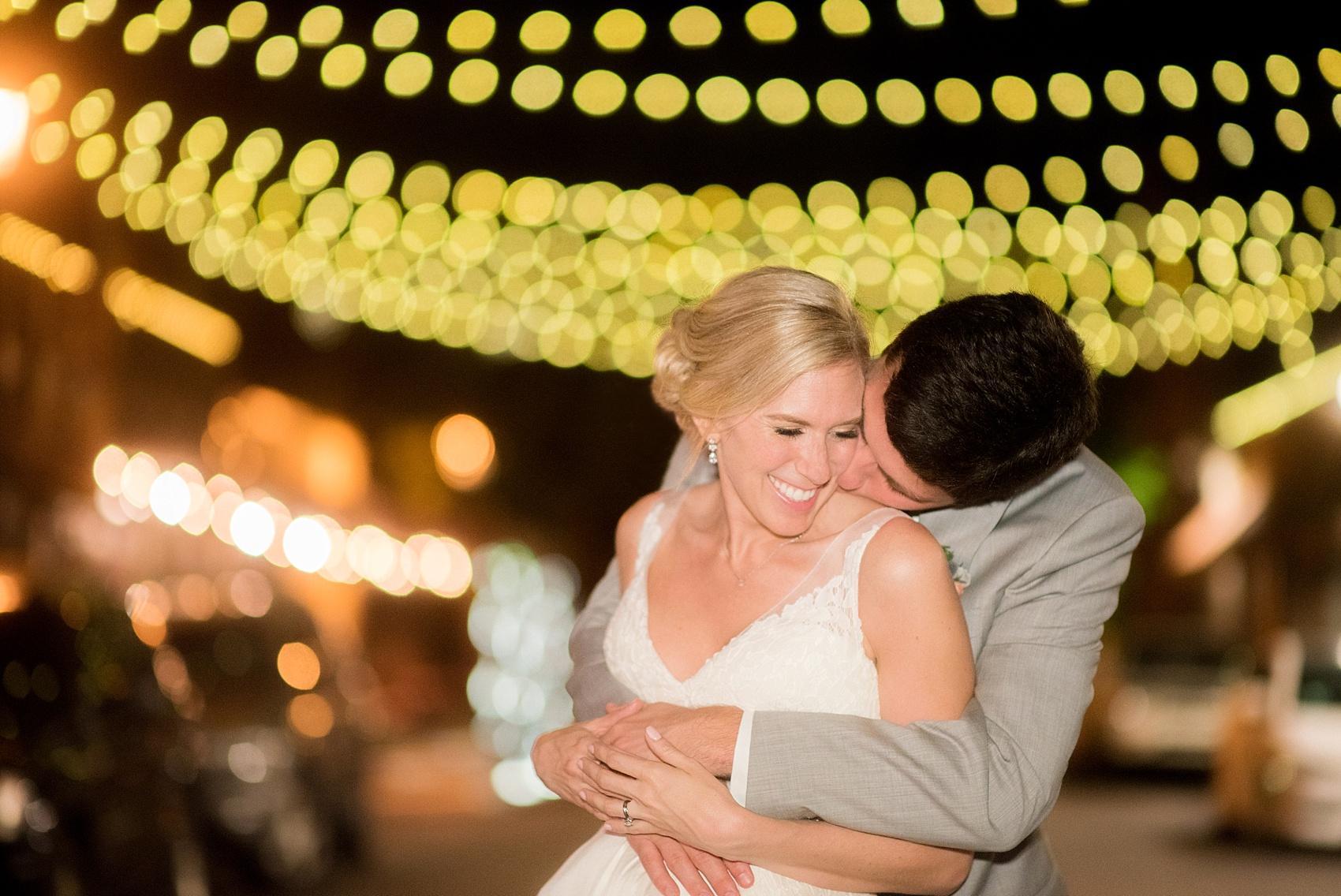 Mikkel Paige Photography pictures of a wedding in Raleigh. Night photo of the bride and groom under the market lights. 