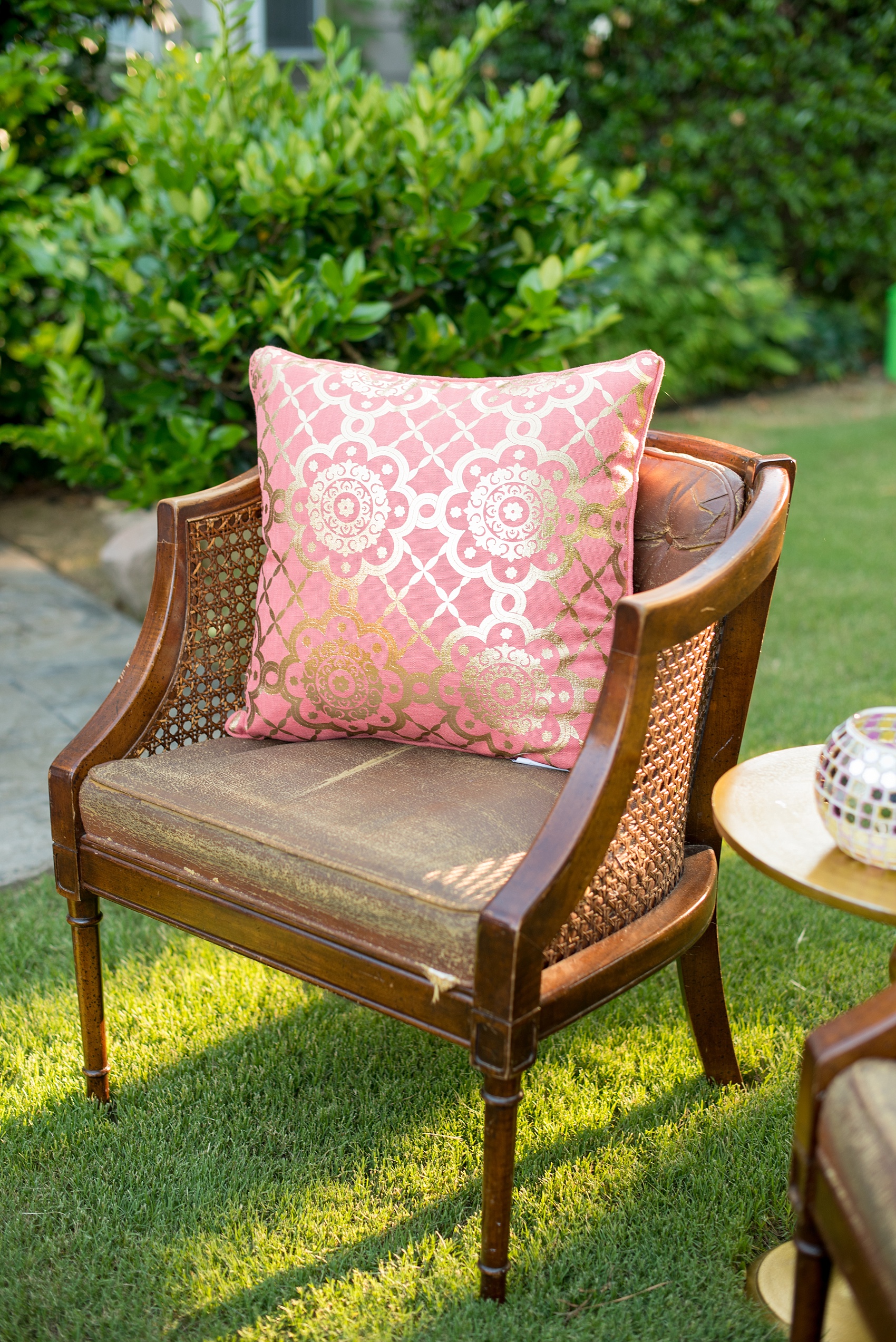 Mikkel Paige Photography photo of Morocco themed outdoor dinner party with vintage furniture and festive Moroccan pillows and lanterns.