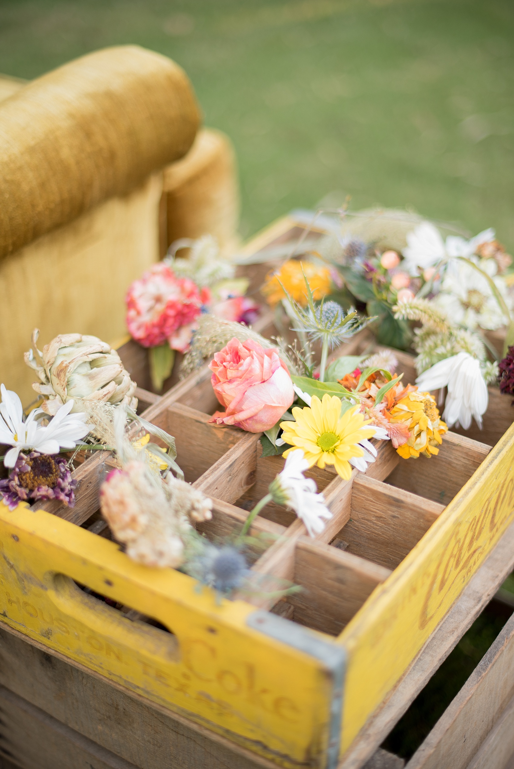Mikkel Paige Photography photo of Moroccan themed party with vintage yellow wood Coke box with flowers.