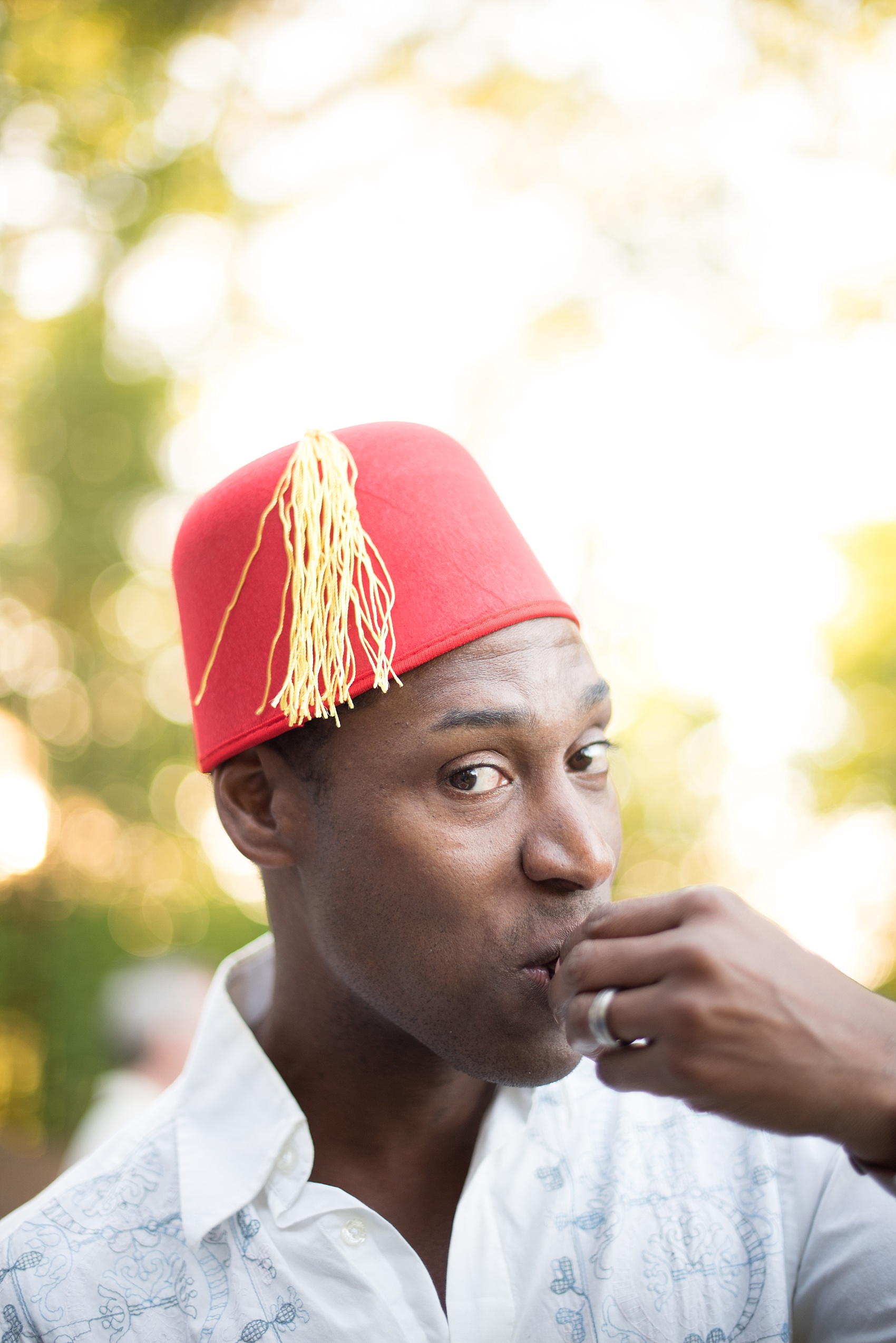 Mikkel Paige Photography photo of Moroccan themed party with festive fez hats.