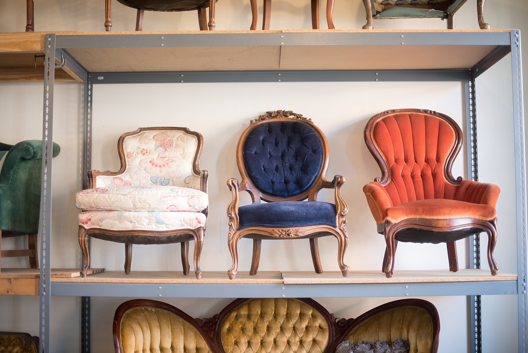 Mikkel Paige Photography photos of vintage furniture renal company Paisley and Jade in Richmond, Virginia. Velvet tufted chairs in red, blue, white and yellow.