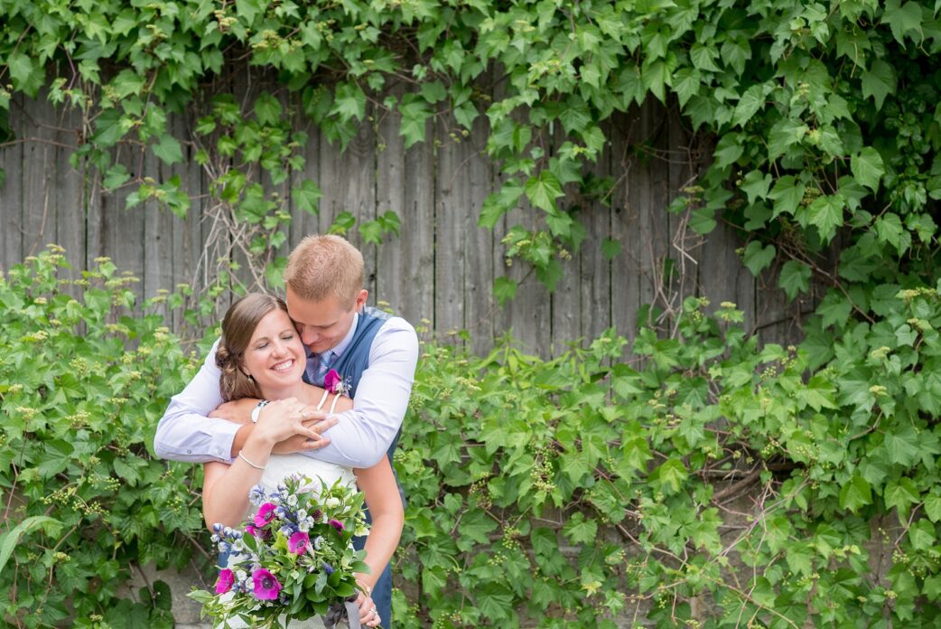 Mikkel Paige Photography photo of an anniversary session with light blue, navy and fuchsia pink accents with a bride and groom.