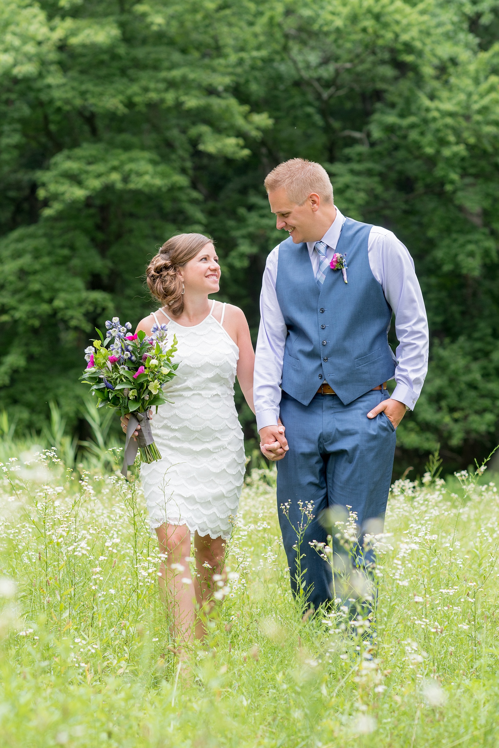 Mikkel Paige Photography photo of an anniversary session with light blue, navy and fuchsia pink accents with a bride and groom.