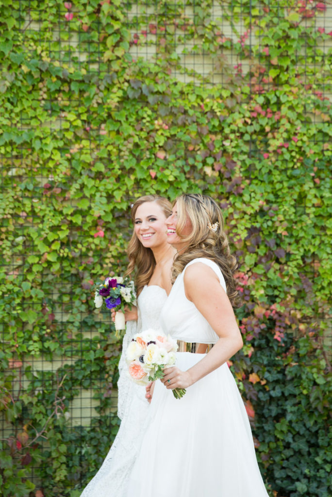Mikkel Paige Photography photos of a wedding at 501 Union in Brooklyn. Same sex gay marriage with the bride in a one shoulder Jenny Yoo gown.