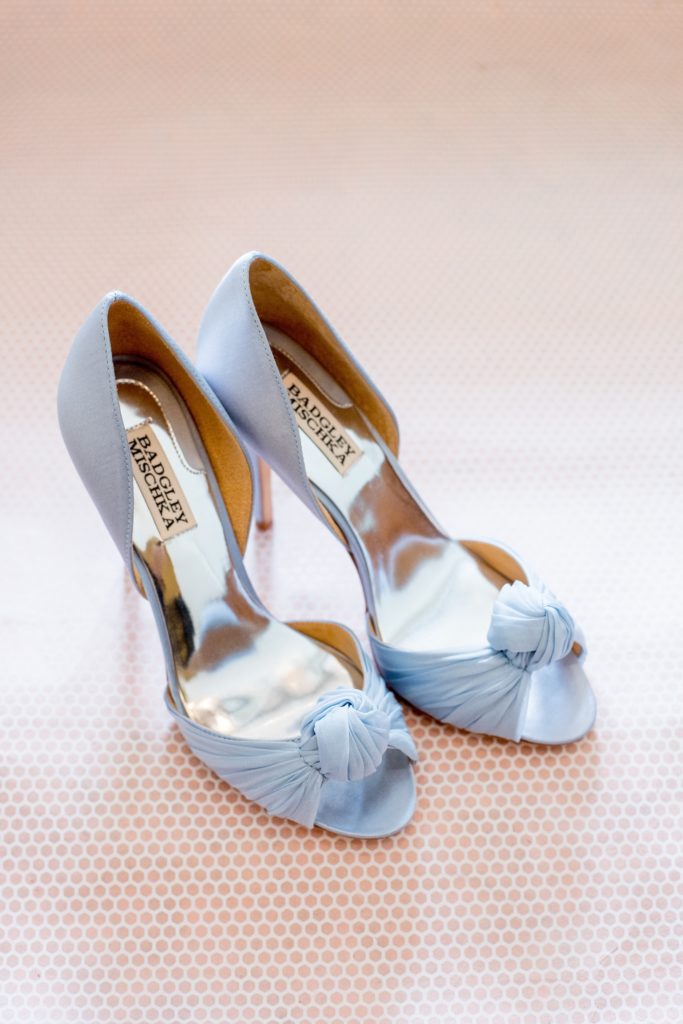 Mikkel Paige Photography photo of a wedding in Basking Ridge, NJ, with the bride's baby blue chiffon Badgley Mischka shoes.