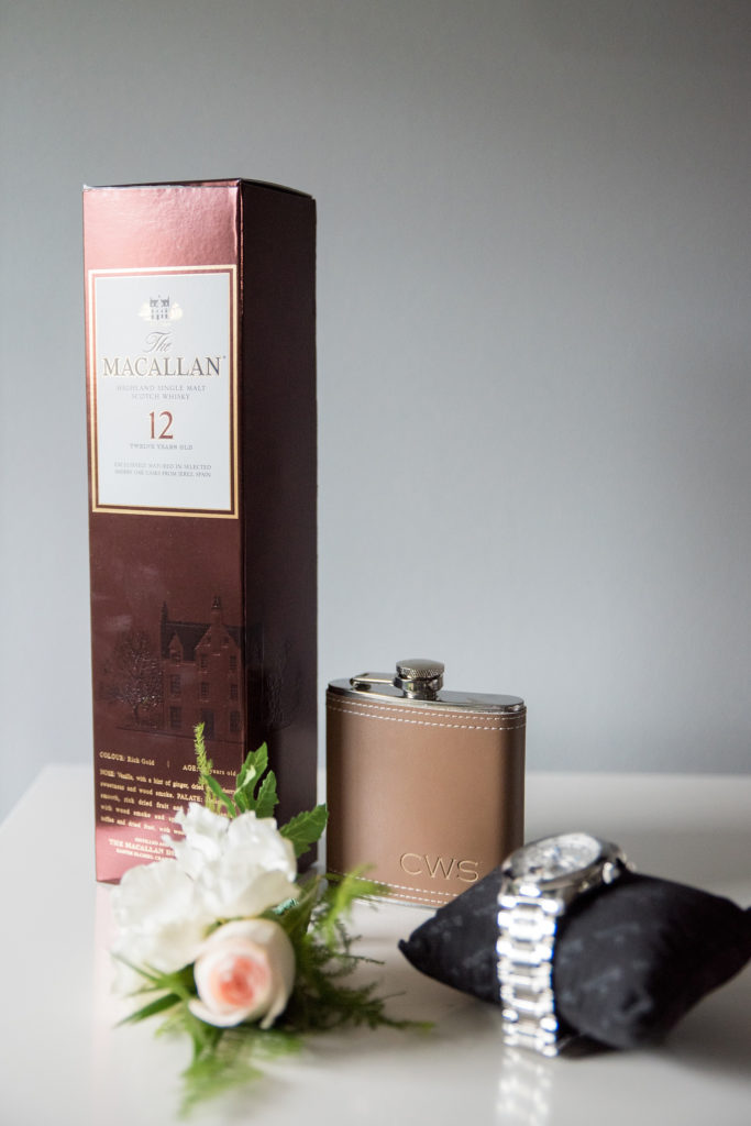 Mikkel Paige Photography photo of a wedding in Basking Ridge, NJ, with the groom's details and groomsmen gift flasks.