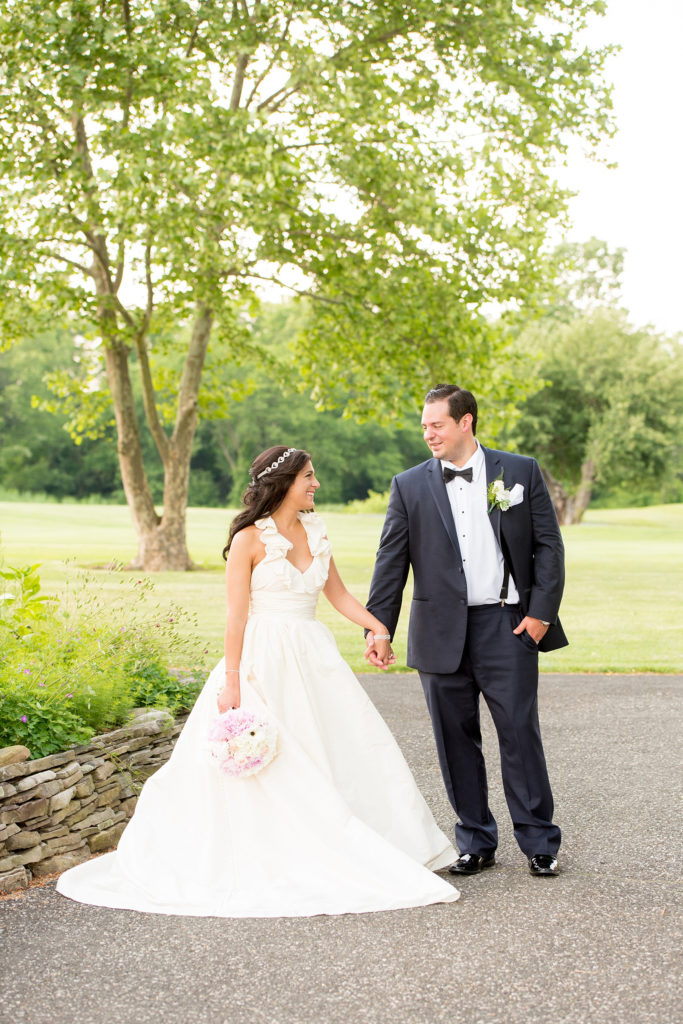 Mikkel Paige Photography photos from a wedding at Basking Ridge Country Club, NJ. The bride in a halter Amsale gown and groom in a navy blue suit.