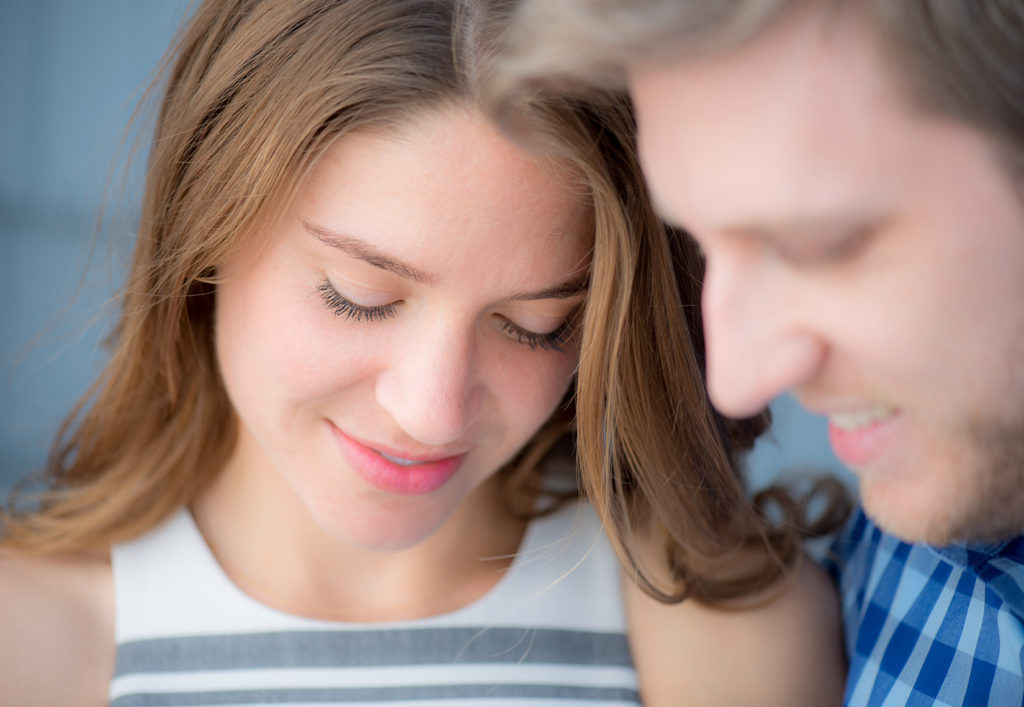 Mikkel Paige Photography beach engagement photos in Bay Head, NJ. The bride and groom embrace.