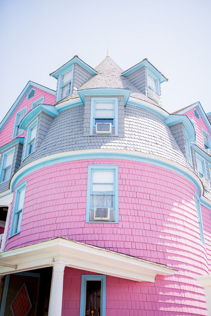 Mikkel Paige Photography beach engagement photos in Bay Head, NJ. Pink and blue local hotel image.