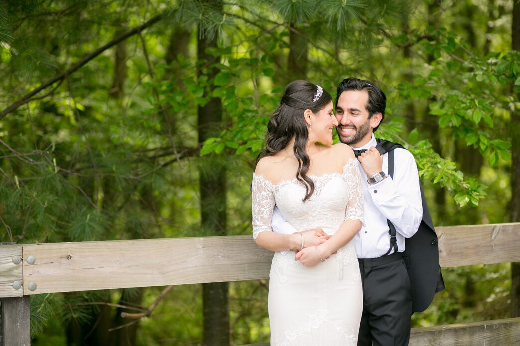 Mikkel Paige Photography photo of a bride and groom in nature on their wedding day at Temple Emanu-el in Closter, NJ.