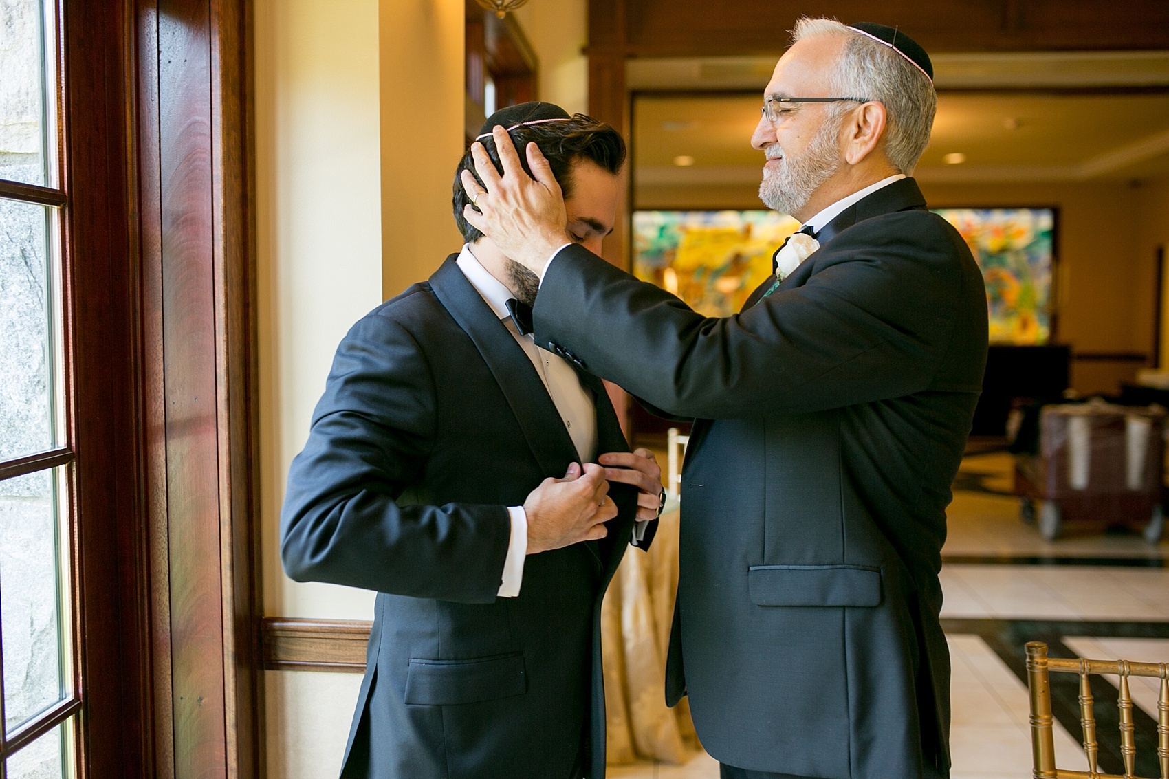 Mikkel Paige Photography photo of the groom and his father preparing for his wedding day at Temple Emanu-El in Closter, NJ.