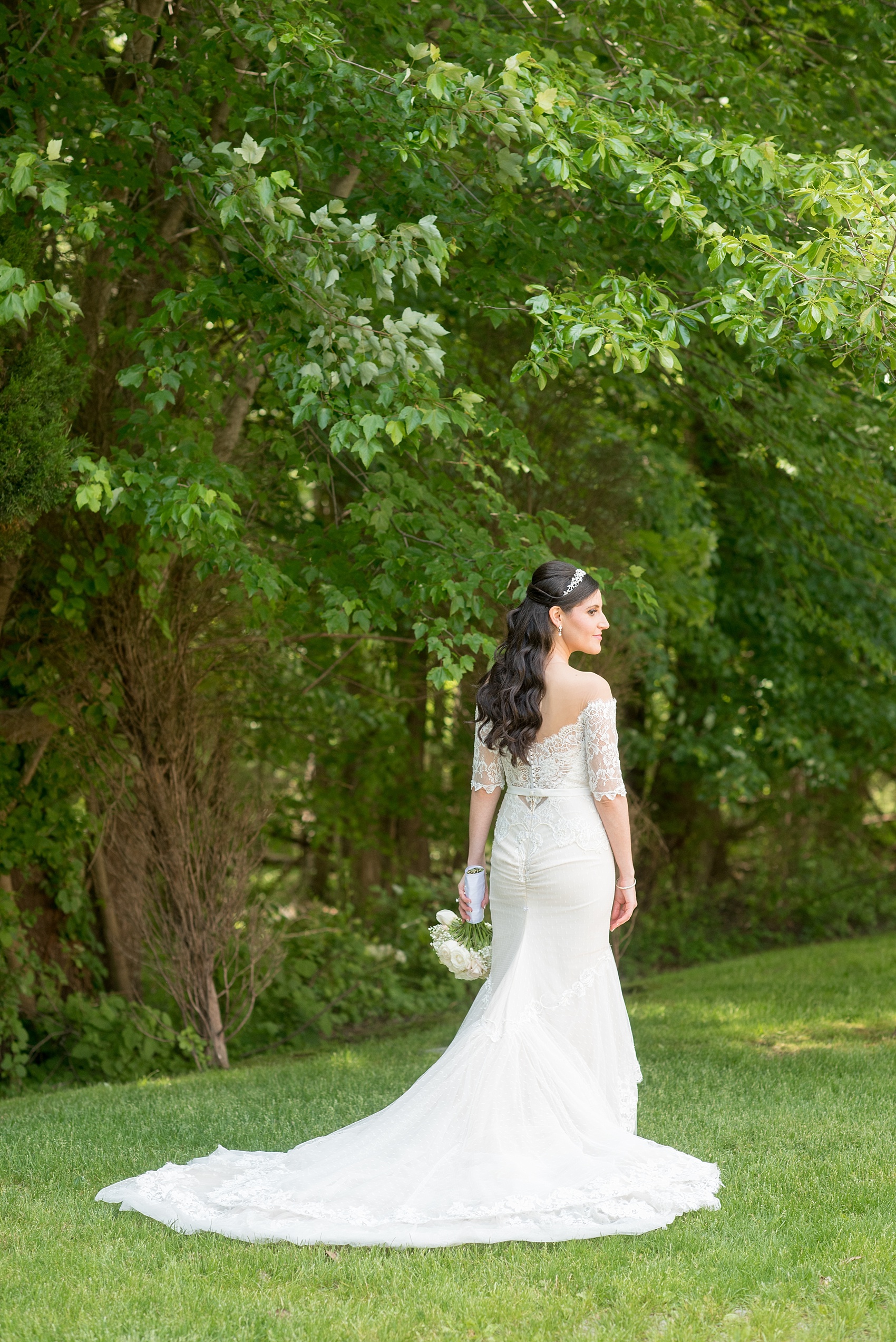 Mikkel Paige Photography photo of the bride in her long sleeve Inbal Dror gown on her wedding day at Temple Emanu-El in Closter, NJ. 