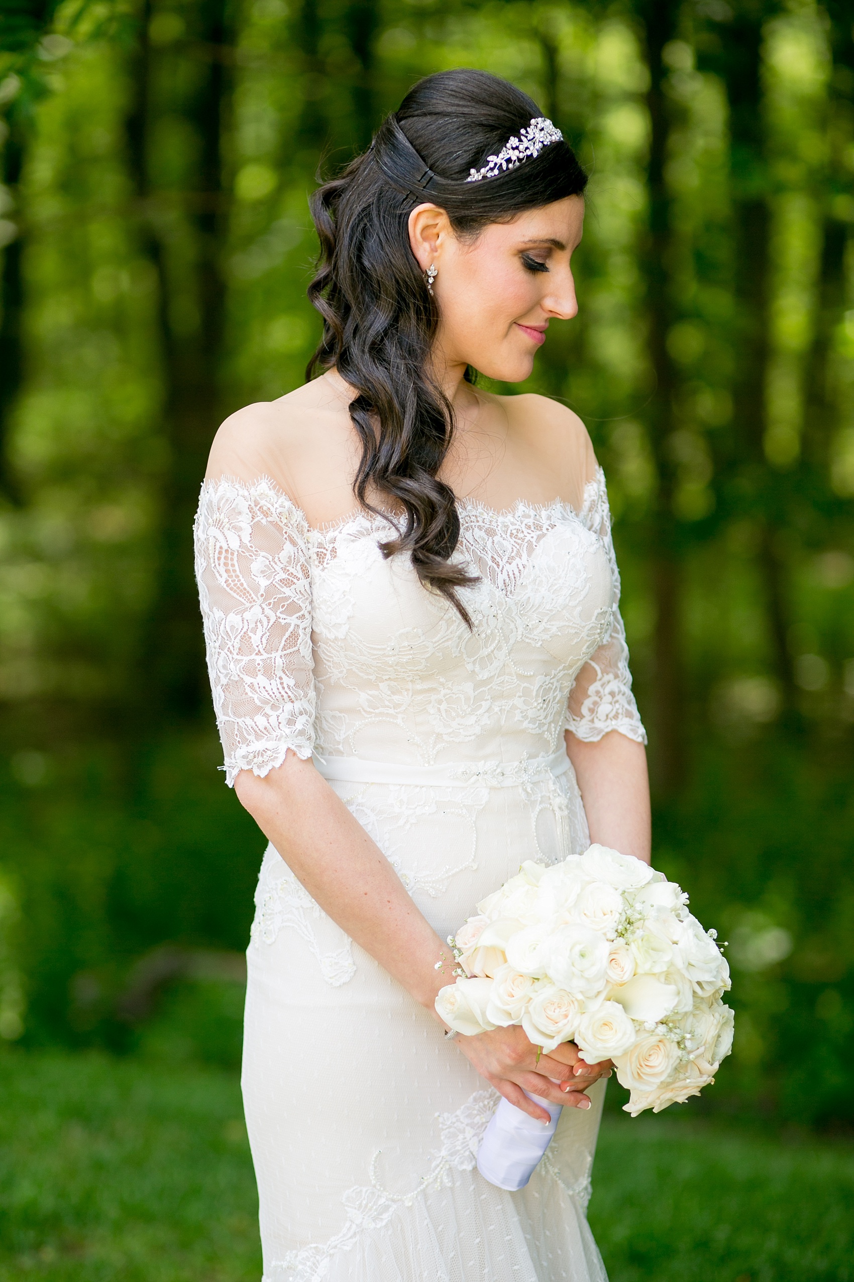 Mikkel Paige Photography photo of the bride in her long sleeve Inbal Dror gown with a rose bouquet on her wedding day at Temple Emanu-El in Closter, NJ. 