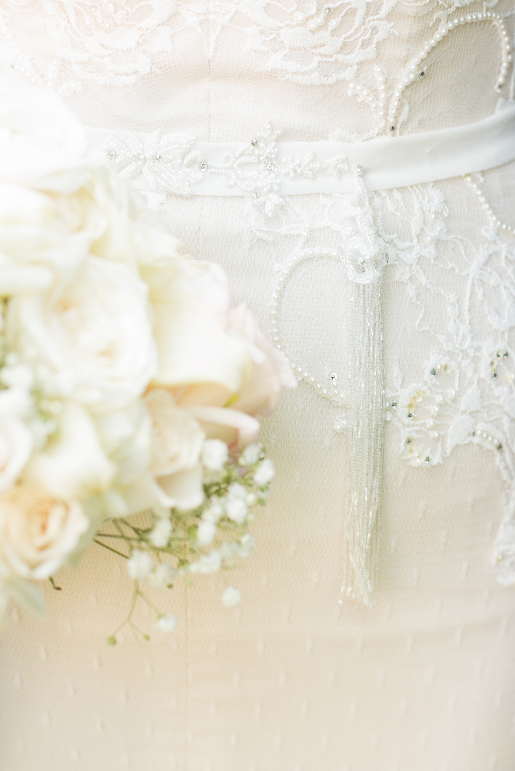 Mikkel Paige Photography photo of the bride in her long sleeve Inbal Dror gown beaded tassel detail on her wedding day at Temple Emanu-El in Closter, NJ. 