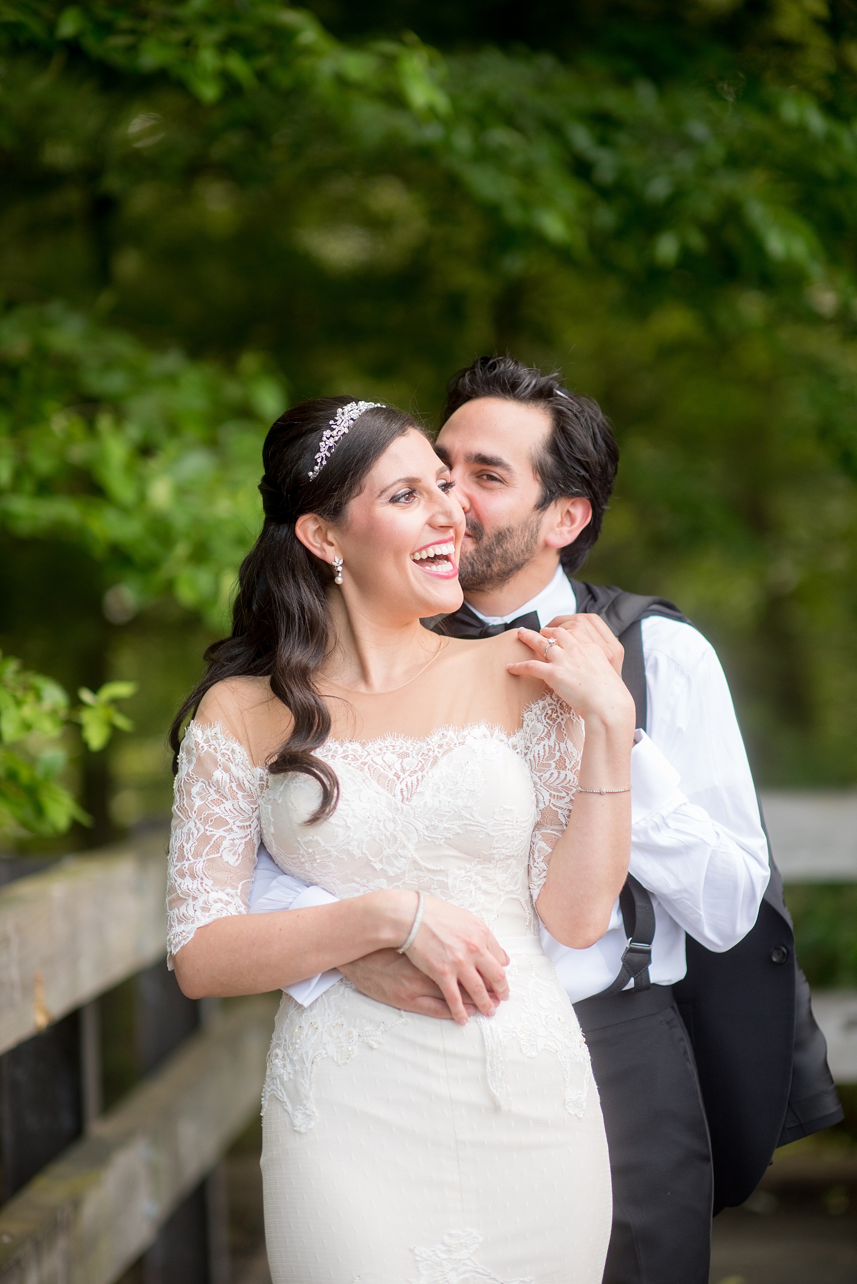 Mikkel Paige Photography photo of the bride in her long sleeve Inbal Dror gown and groom on their wedding day at Temple Emanu-El in Closter, NJ. 