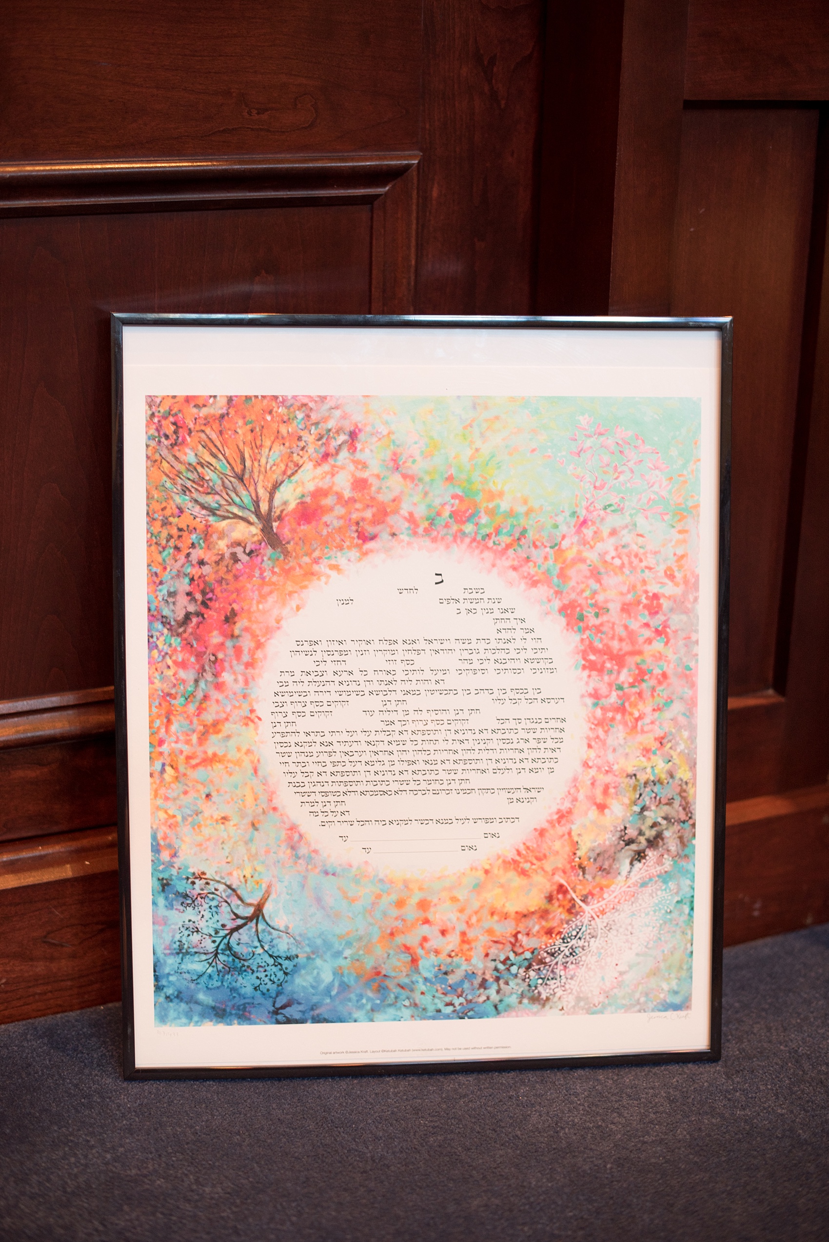 Mikkel Paige Photography photo of the colorful ketubah at a Jewish religion ceremony at Temple Emanu-El in Closter, NJ.