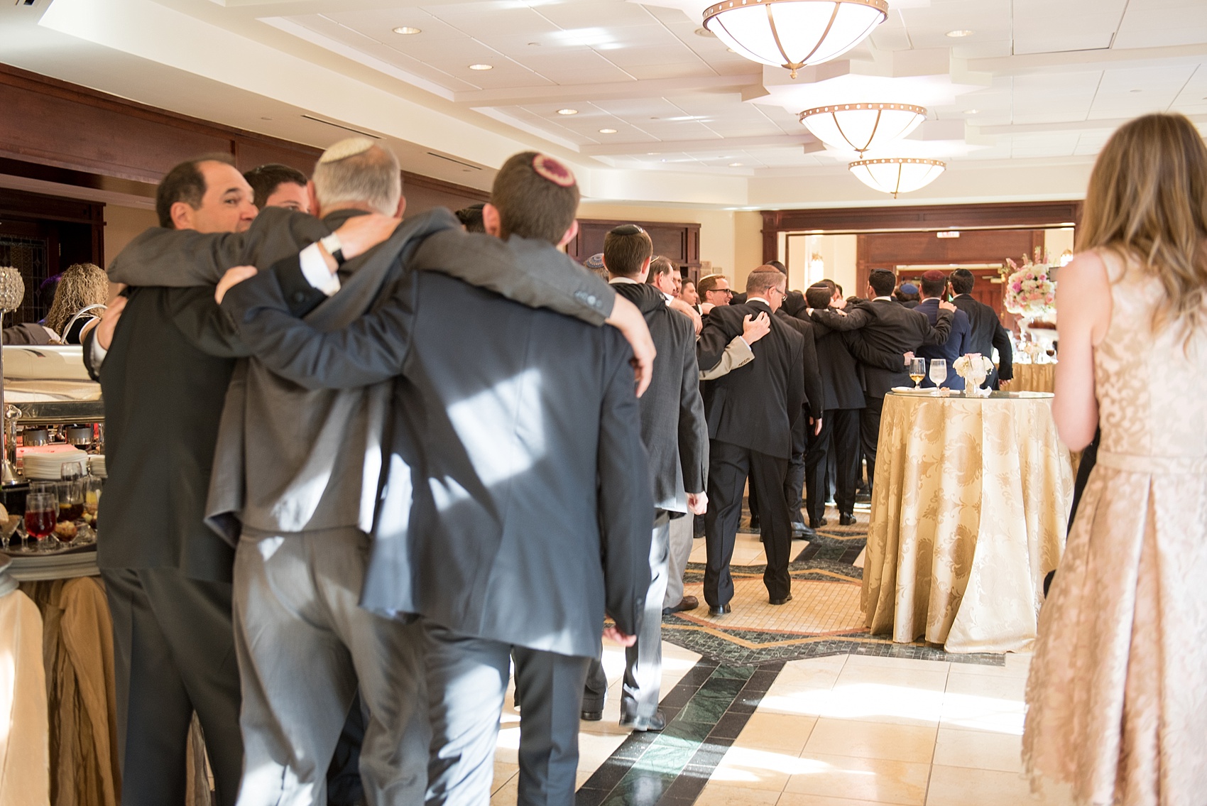 Mikkel Paige Photography photo of the groom at his Jewish religion tish at Temple Emanu-El in Closter, NJ.