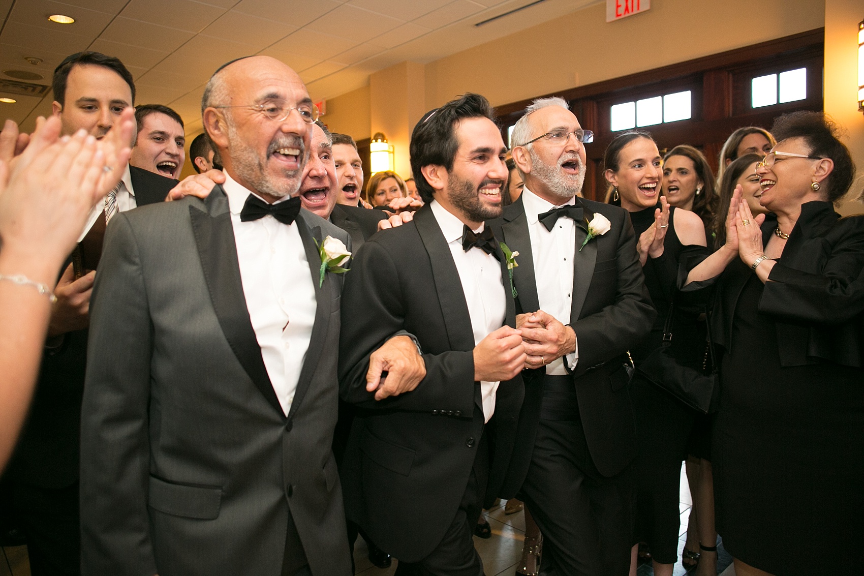 Mikkel Paige Photography photo of the groom at his Jewish religion tish at Temple Emanu-El in Closter, NJ.