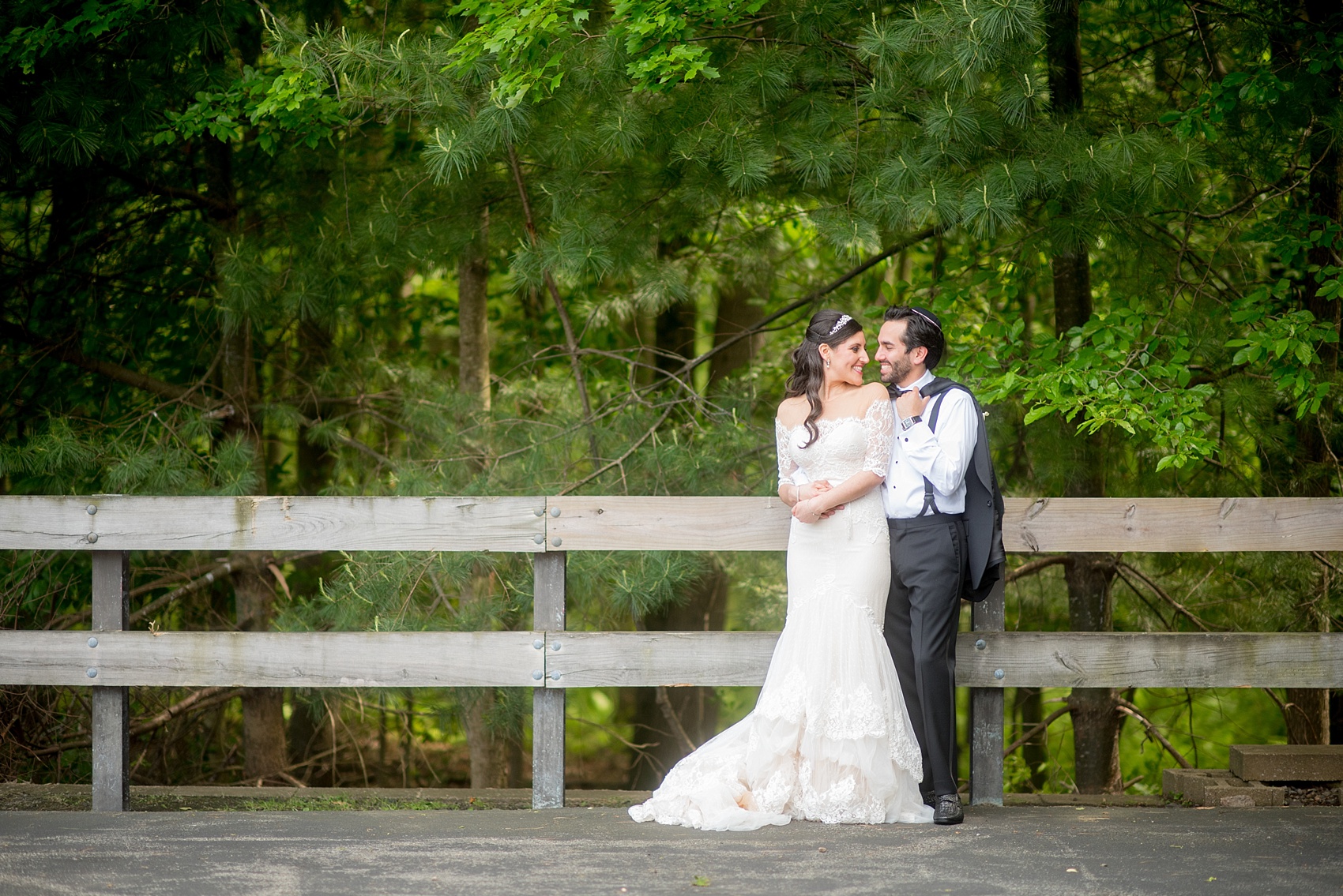 Mikkel Paige Photography photo of the bride in her long sleeve Inbal Dror gown and groom on their wedding day at Temple Emanu-El in Closter, NJ. 