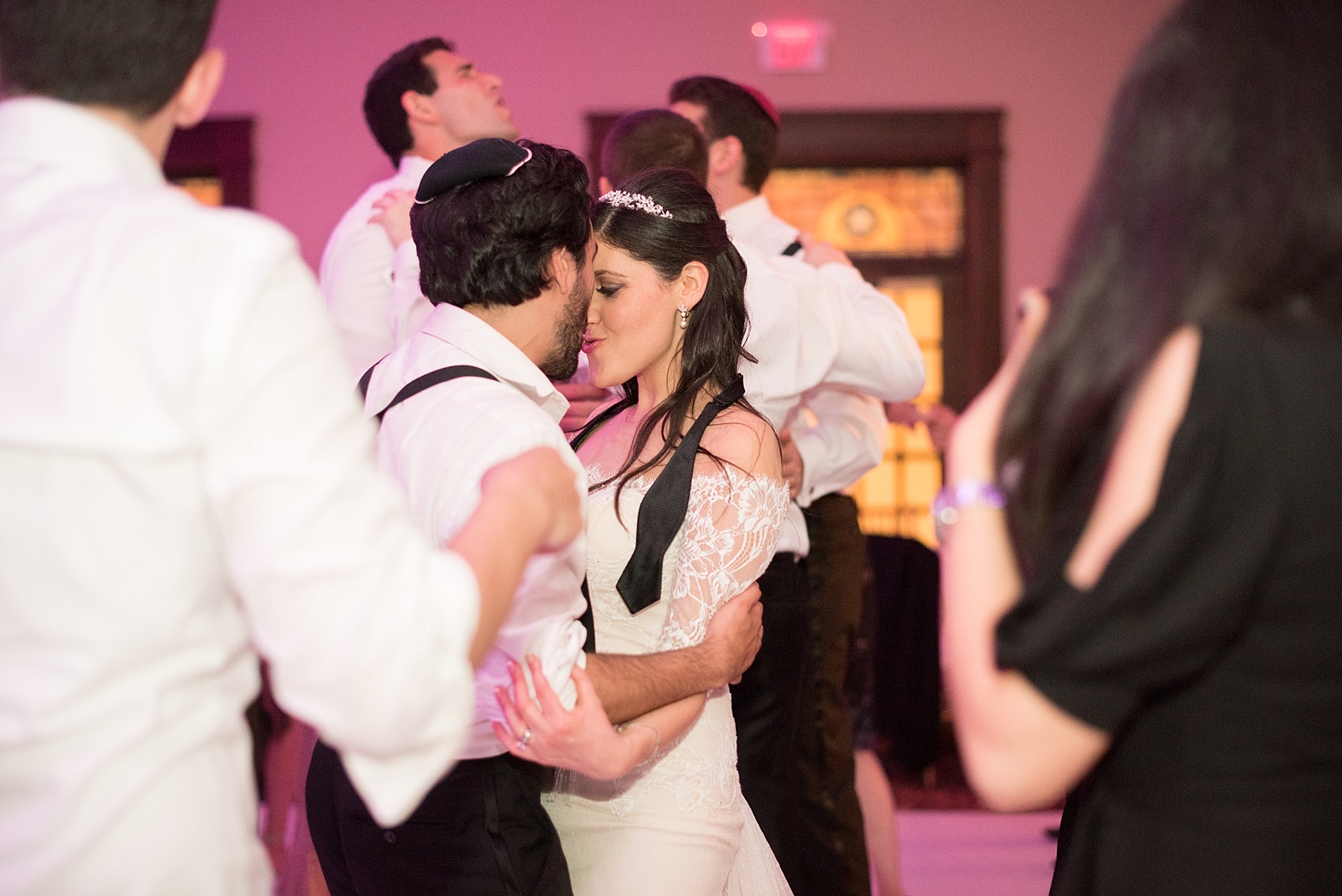 Mikkel Paige Photography photos of an elegant reception with pink and white details at Temple Emanu-El in Closter, NJ with floral centerpieces high and low.