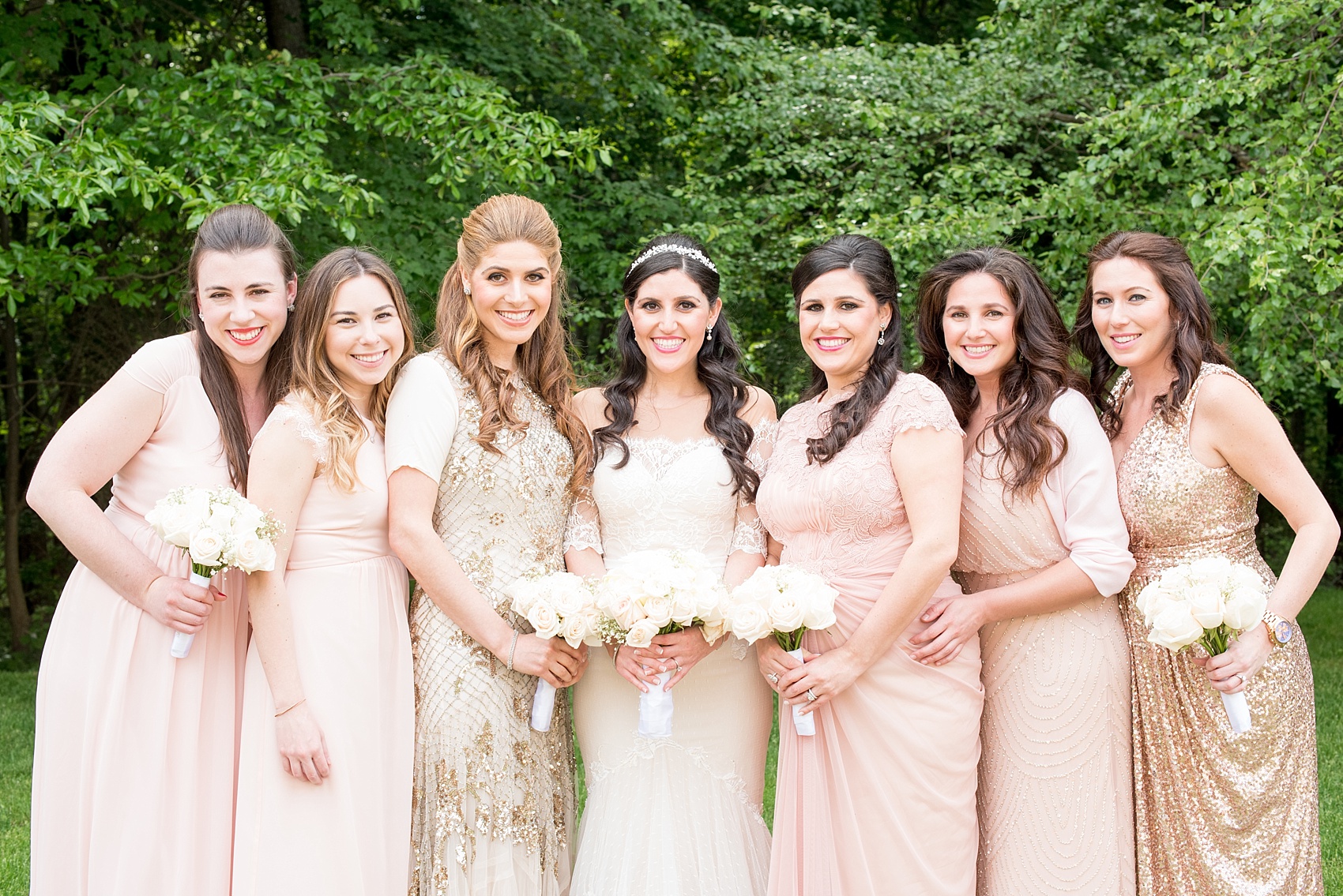 Mikkel Paige Photography photo of the bridesmaids in light pink blush mismatched dresses of their choice. Orthodox Jewish wedding at Temple Emanu-El in Closter, NJ.