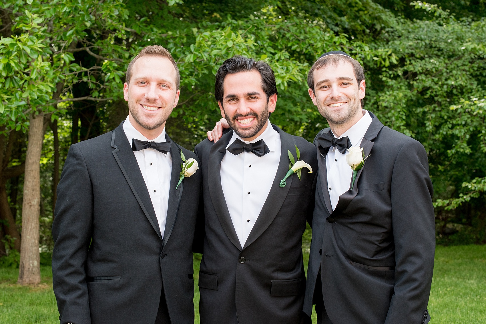 Mikkel Paige Photography photo of the groom and his groomsmen in classic black tuxedos for an orthodox Jewish wedding at Temple Emanu-El in Closter, NJ.