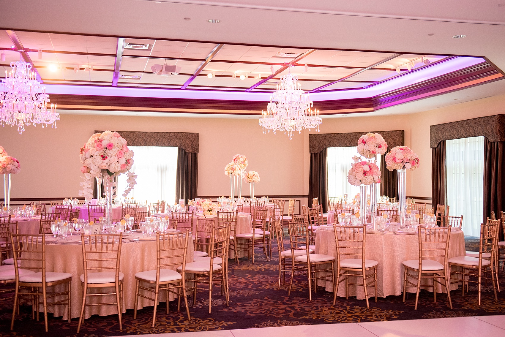 Mikkel Paige Photography photos of an elegant reception with pink and white details at Temple Emanu-El in Closter, NJ.