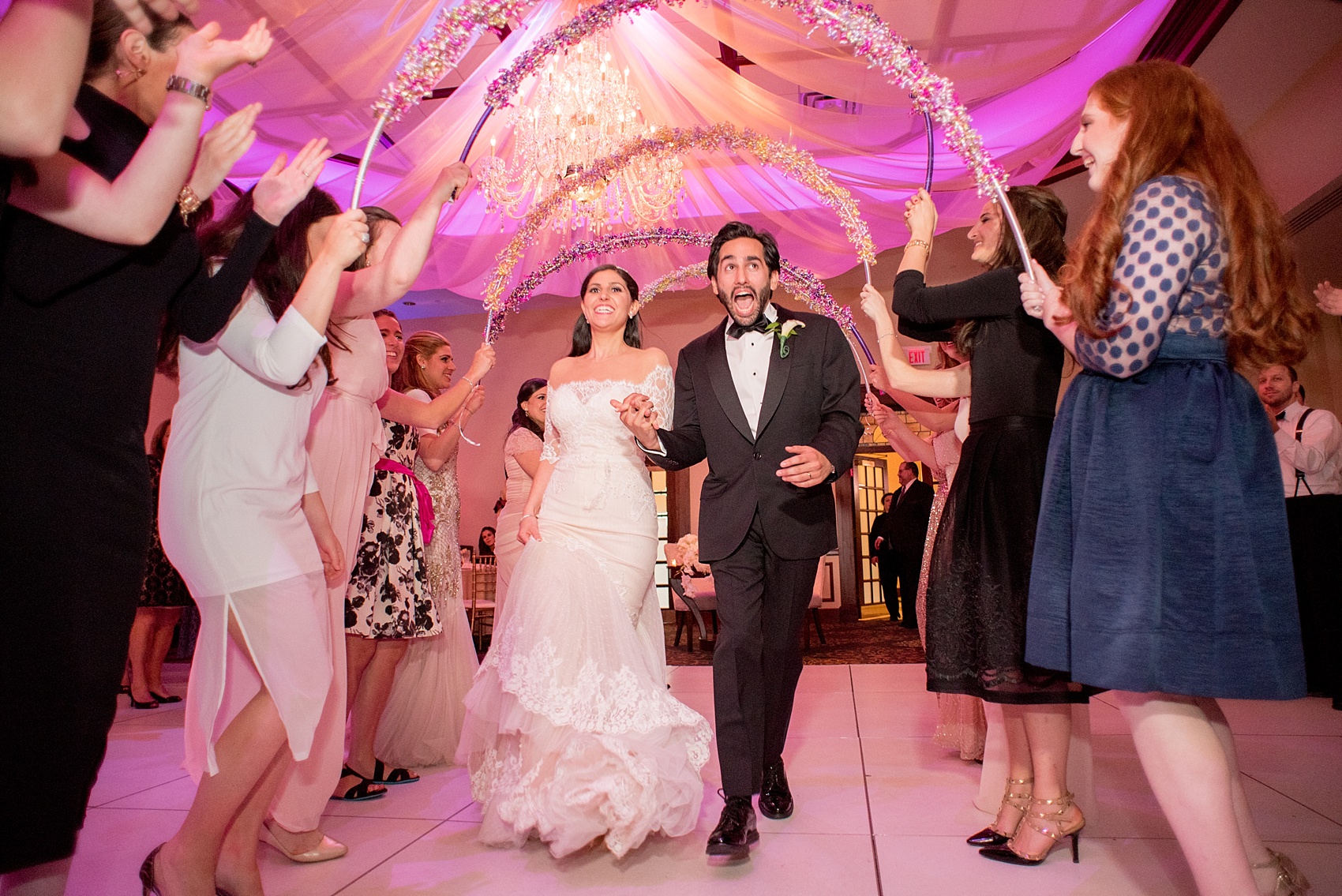 Mikkel Paige Photography photos of an elegant reception with pink and white details at Temple Emanu-El in Closter, NJ.